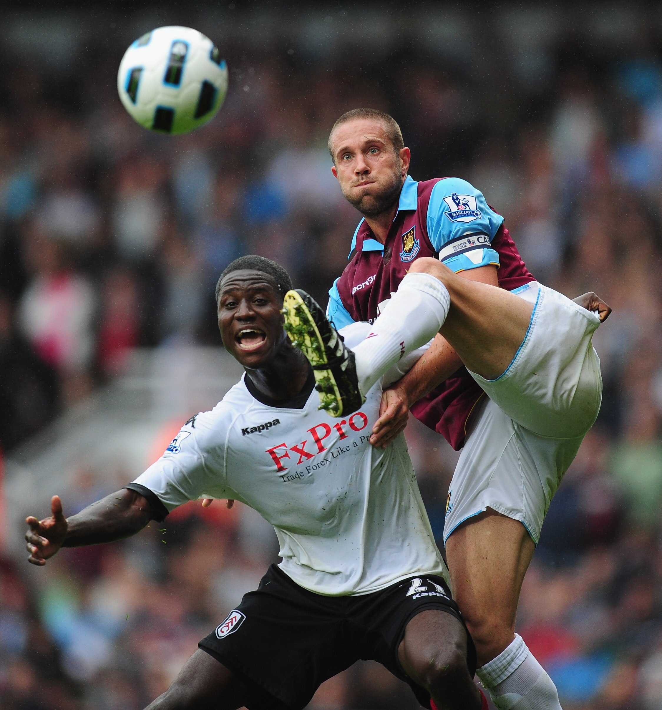 LONDON, ENGLAND - OCTOBER 02:  Matthew Upson of West Ham battles with Eddie Johnson of Fulham during the Barclays Premier League match between West Ham United and Fulham at Boleyn Ground on October 2, 2010 in London, England.  (Photo by Mike Hewitt/Getty