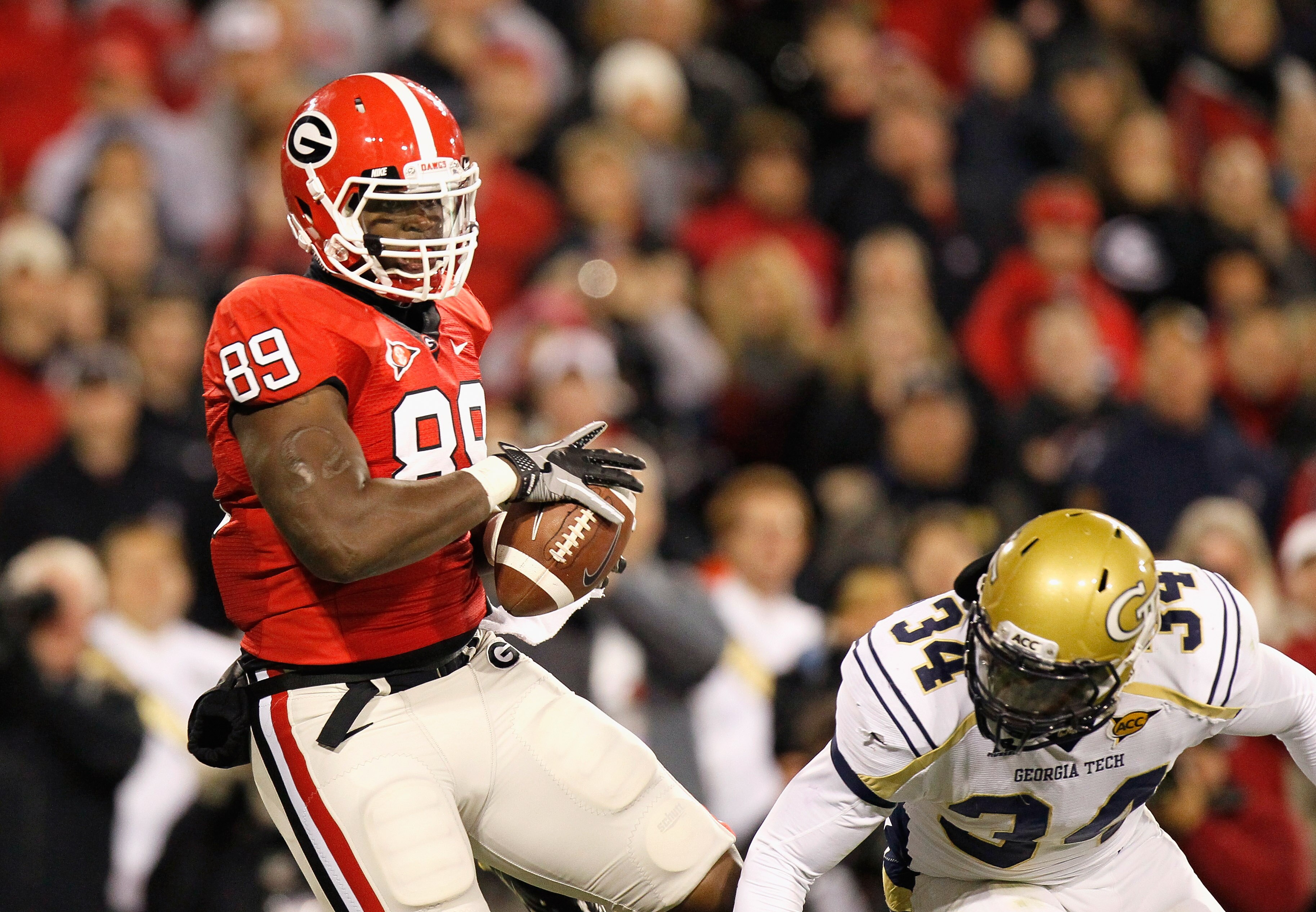 ATHENS, GA - NOVEMBER 27:  Bruce Figgins #89 of the Georgia Bulldogs pulls in this touchdown reception against Steven Sylvester #34 of the Georgia Tech Yellow Jackets at Sanford Stadium on November 27, 2010 in Athens, Georgia.  (Photo by Kevin C. Cox/Gett