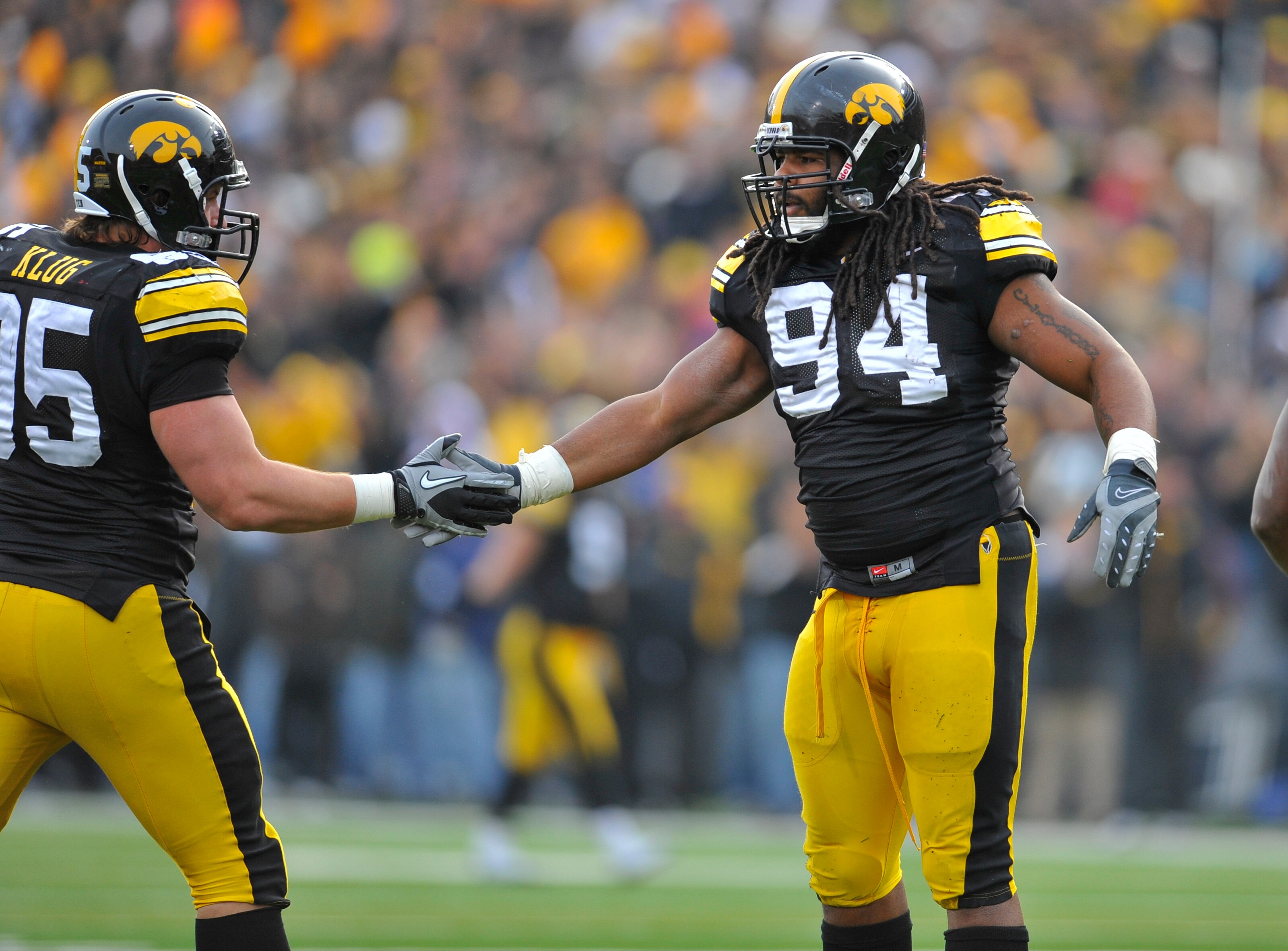 IOWA CITY, IA - NOVEMBER 20:  Defensive linemen Adrian Clayborn #94 and Karly Klug #95 of the University of Iowa Hawkeyes celebrate a quarterback sack against the Ohio State Buckeyes during the first half of play at Kinnick Stadium on November 20, 2010 in