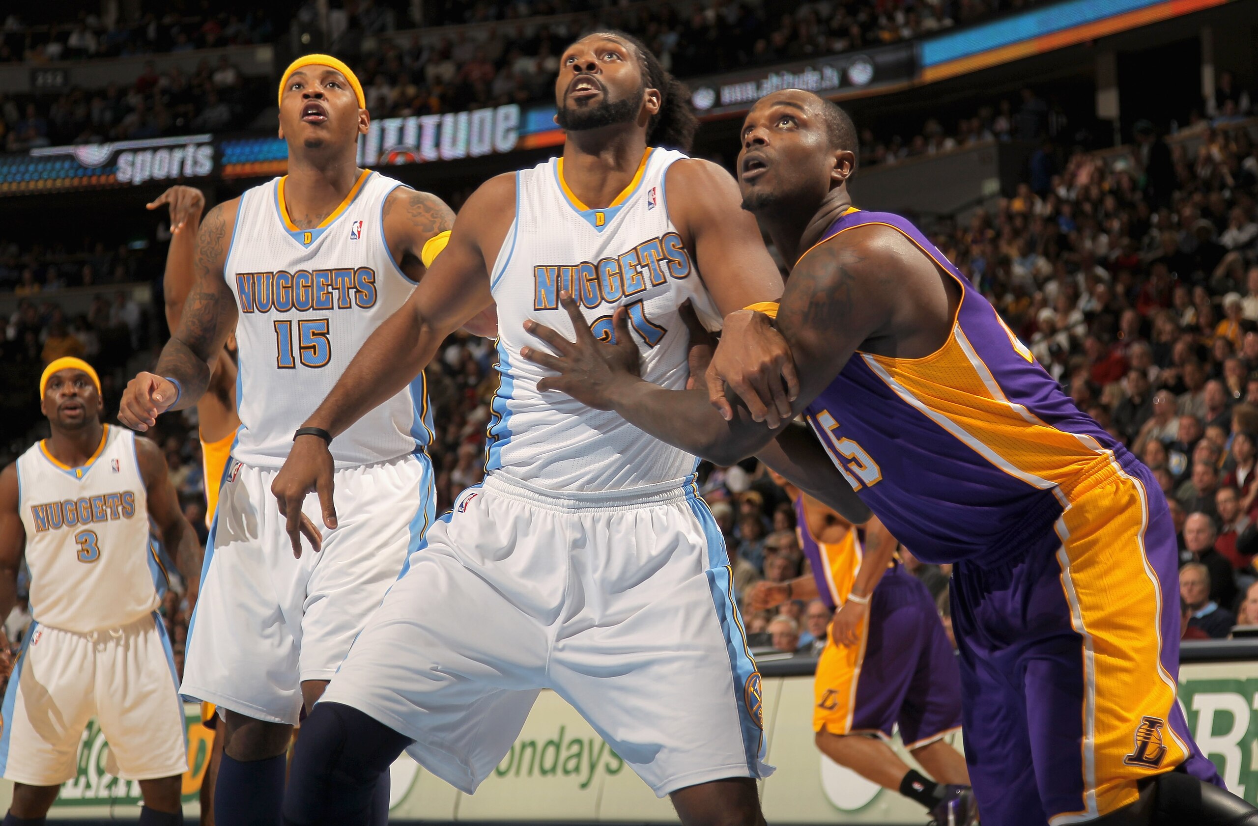 DENVER - NOVEMBER 11: Carmelo Anthony #15 and Nene #31 of the Denver Nuggets and Derrick Caracter #45 of the Los Angeles Lakers vie for rebounding position at the Pepsi Center on November 11, 2010 in Denver, Colorado. The Nuggets defeated the Lakers 118- DENVER - NOVEMBER 11: Carmelo Anthony #15 and Nene #31 of the Denver Nuggets and Derrick Caracter #45 of the Los Angeles Lakers vie for rebounding position at the Pepsi Center on November 11, 2010 in Denver, Colorado. The Nuggets defeated the Lakers 118-