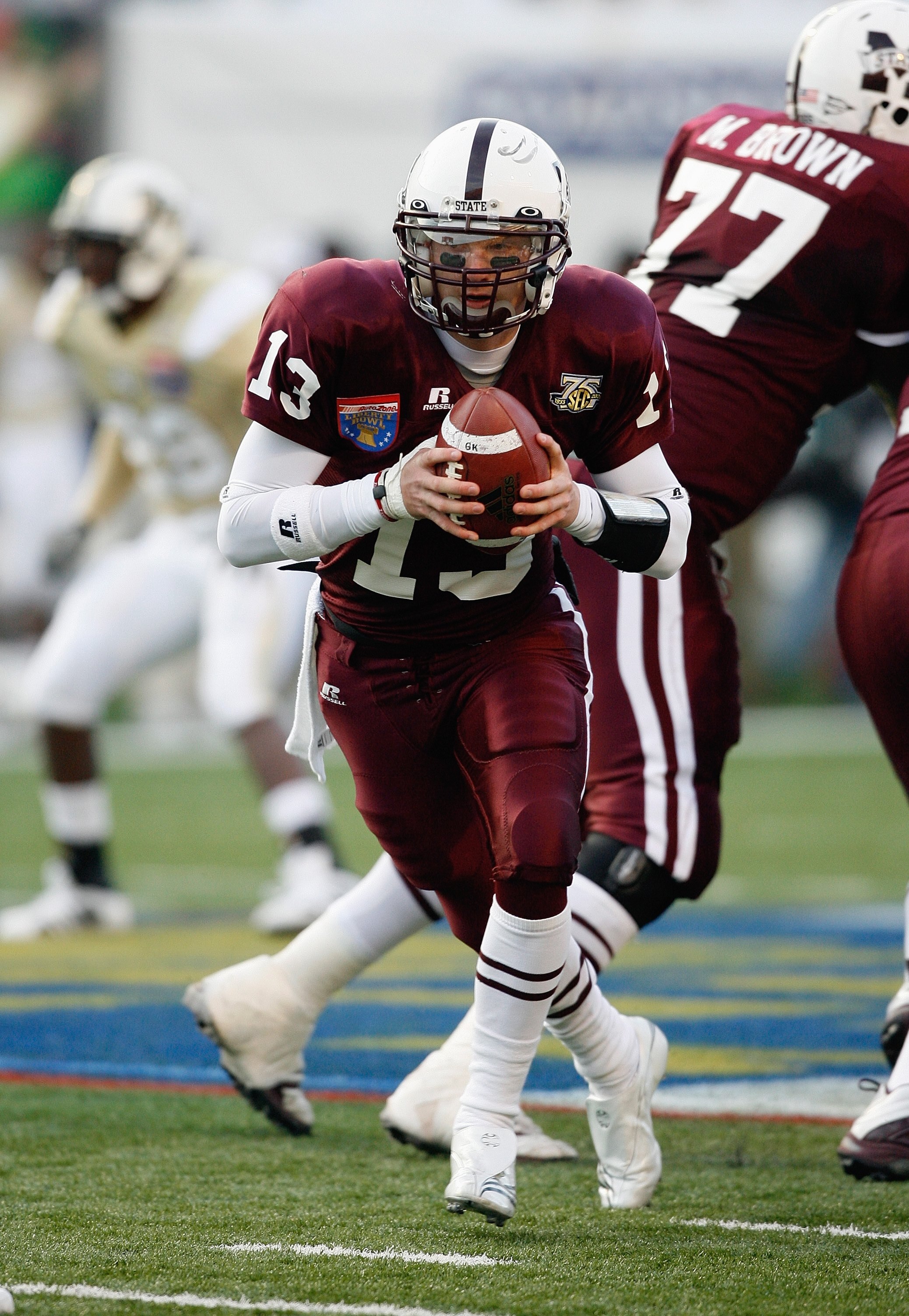 MEMPHIS, TN - DECEMBER 29: Wesley Carroll #13 of the Mississippi State Bulldogs looks to hand off the ball against the UCF Knights on December 29, 2007 at the Liberty Bowl Memorial Stadium in Memphis, Tennessee. The Bulldogs beat the Knights 10-3. (Photo