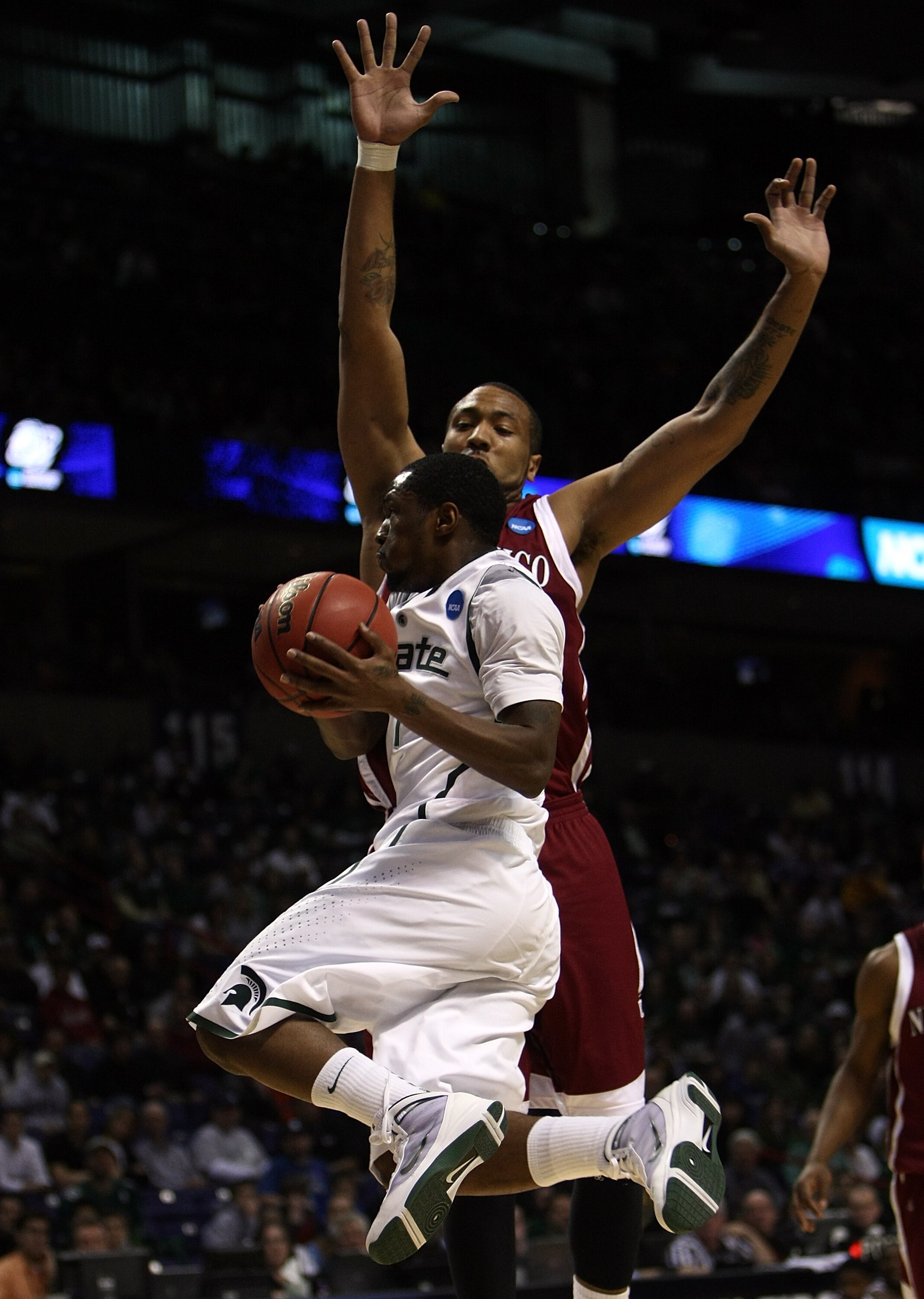 SPOKANE, WA - MARCH 19:  Kalin Lucas #1 of the Michigan St. Spartans drives to the basket against Troy Gillenwater #33 of the New Mexico St. Aggies during the first round of the 2010 NCAA men's basketball tournament at Spokane Arena on March 19, 2010 in S