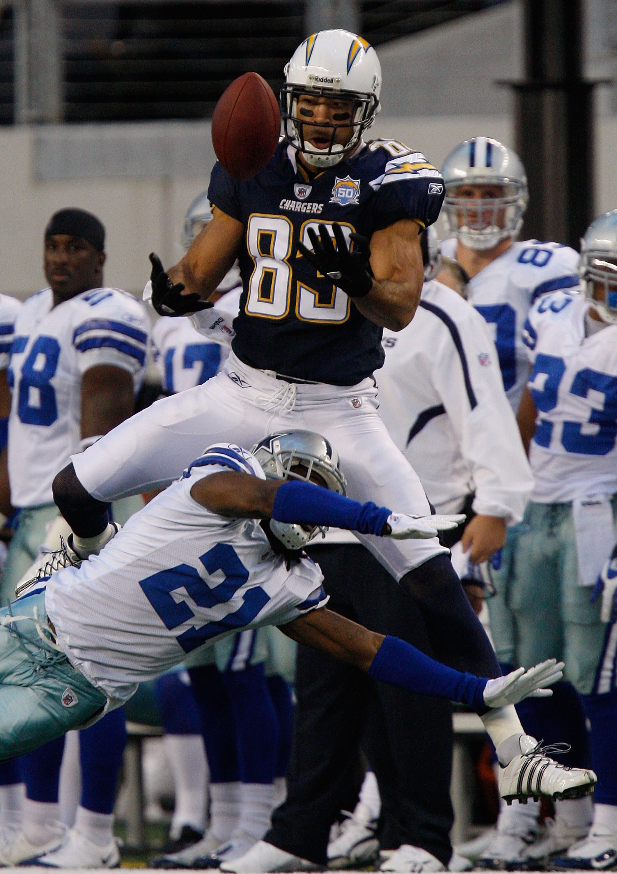 ARLINGTON, TX - DECEMBER 13:  Wide receiver Vincent Jackson #83 of the San Diego Chargers makes a pass reception against Mike Jenkins #21 of the Dallas Cowboys at Cowboys Stadium on December 13, 2009 in Arlington, Texas.  (Photo by Ronald Martinez/Getty I