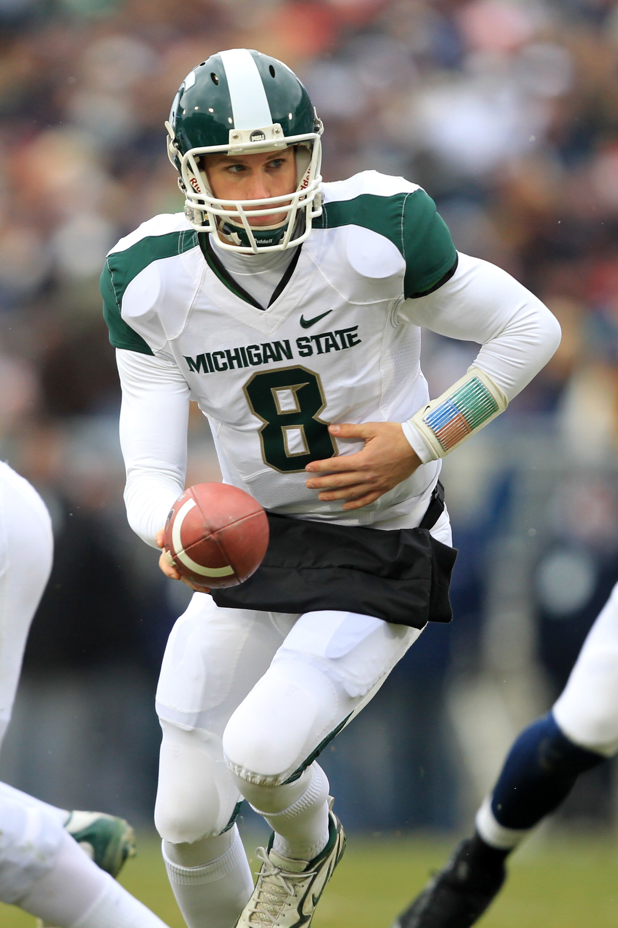 STATE COLLEGE, PA - NOVEMBER 27: Quarterback Kirk Cousins #8 of the Michigan State Spartans hands off during a game against the Penn State Nittany Lions on November 27, 2010 at Beaver Stadium in State College, Pennsylvania. The Spartans won 28-22. (Photo