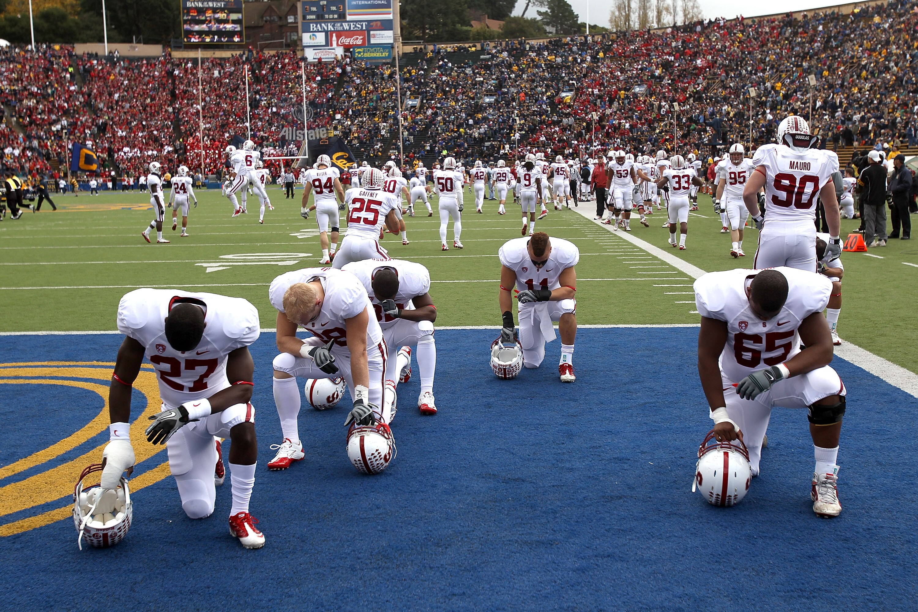 BERKELEY, CA - NOVEMBER 20:  Players for the Stanford Cardinal pray before their game against the California Golden Bears at California Memorial Stadium on November 20, 2010 in Berkeley, California.  (Photo by Ezra Shaw/Getty Images)