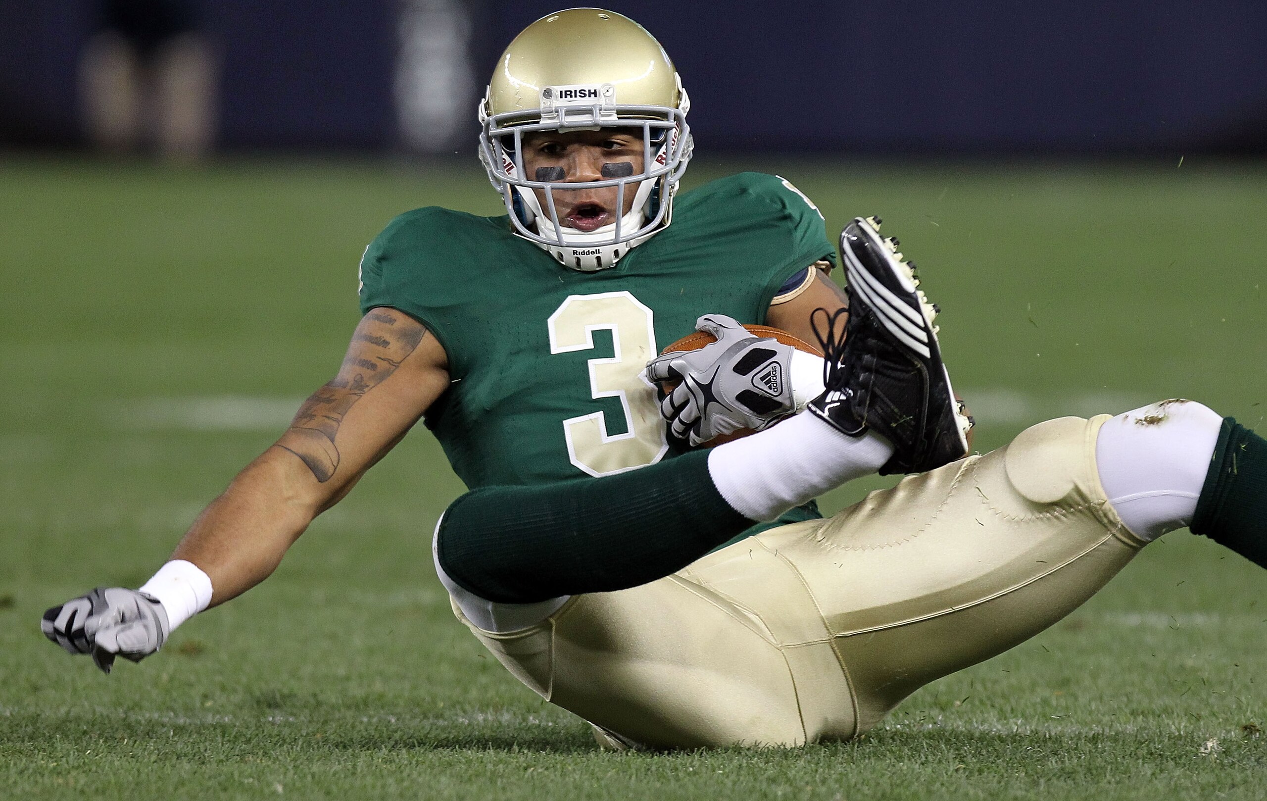 NEW YORK - NOVEMBER 20:  Michael Floyd #3 of the Notre Dame Fighting Irish loses his footing against the Army Black Knights at Yankee Stadium on November 20, 2010 in the Bronx borough of New York City.  (Photo by Nick Laham/Getty Images)