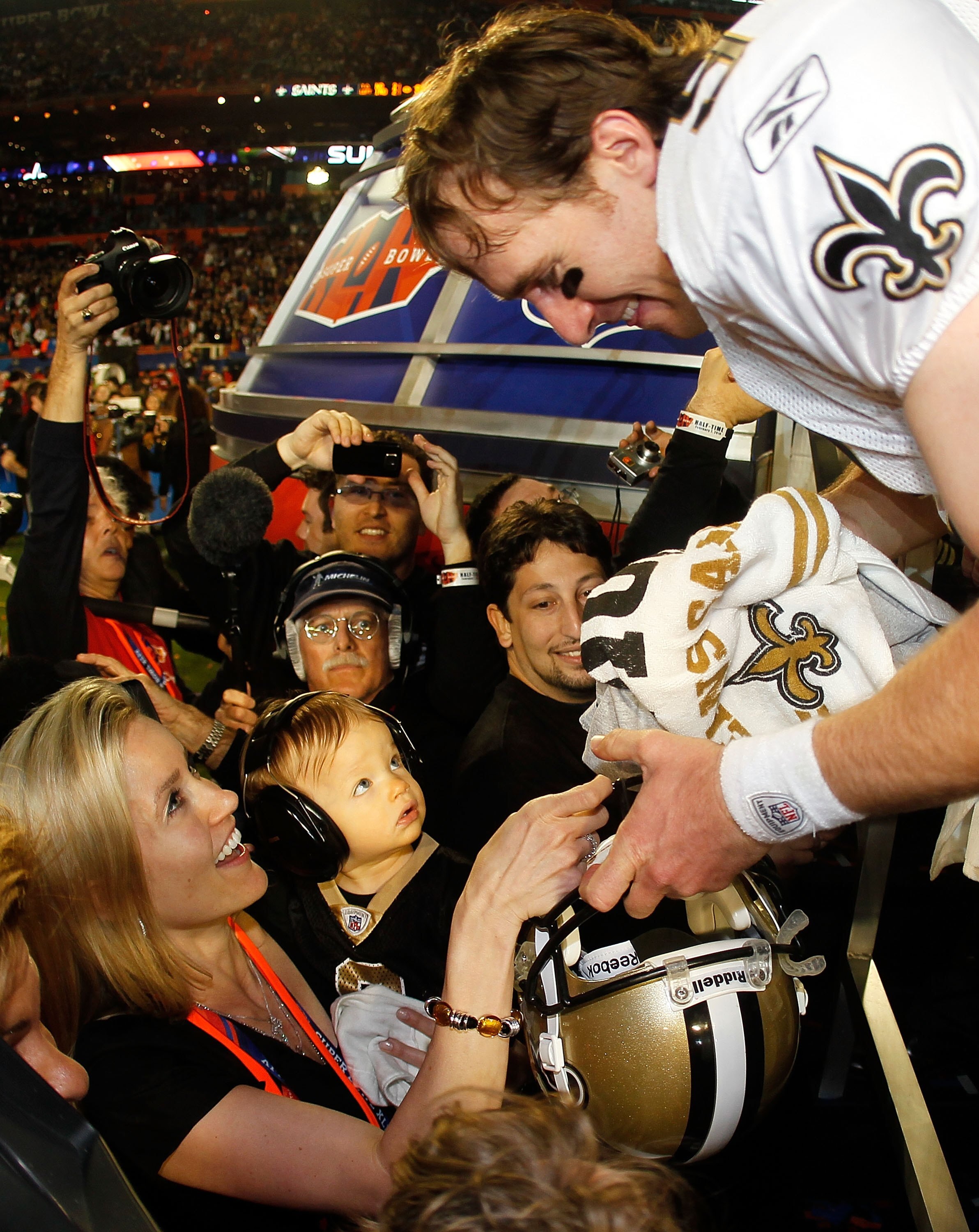 MIAMI GARDENS, FL - FEBRUARY 07:  Drew Brees #9 of the New Orleans Saints celebrates with his son Baylen Brees and wife Brittany Brees after defeating the Indianapolis Colts during Super Bowl XLIV on February 7, 2010 at Sun Life Stadium in Miami Gardens, 