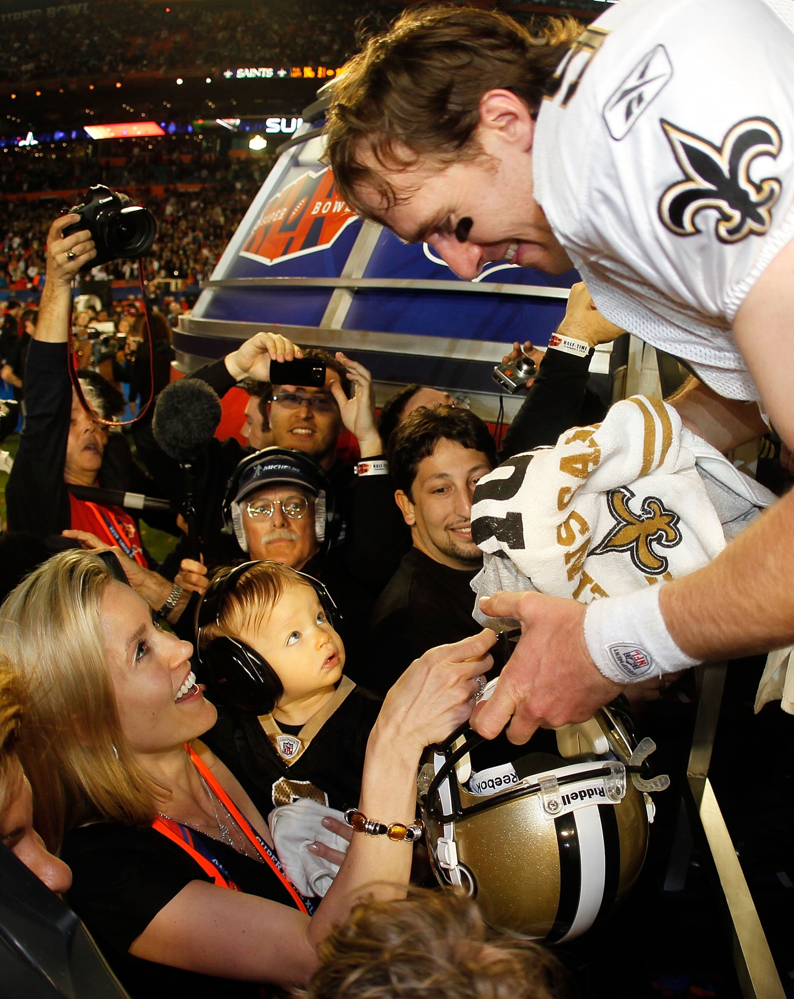 MIAMI GARDENS, FL - FEBRUARY 07: Drew Brees #9 of the New Orleans Saints celebrates with his son Baylen Brees and wife Brittany Brees after defeating the Indianapolis Colts during Super Bowl XLIV on February 7, 2010 at Sun Life Stadium in Miami Gardens, MIAMI GARDENS, FL - FEBRUARY 07: Drew Brees #9 of the New Orleans Saints celebrates with his son Baylen Brees and wife Brittany Brees after defeating the Indianapolis Colts during Super Bowl XLIV on February 7, 2010 at Sun Life Stadium in Miami Gardens,
