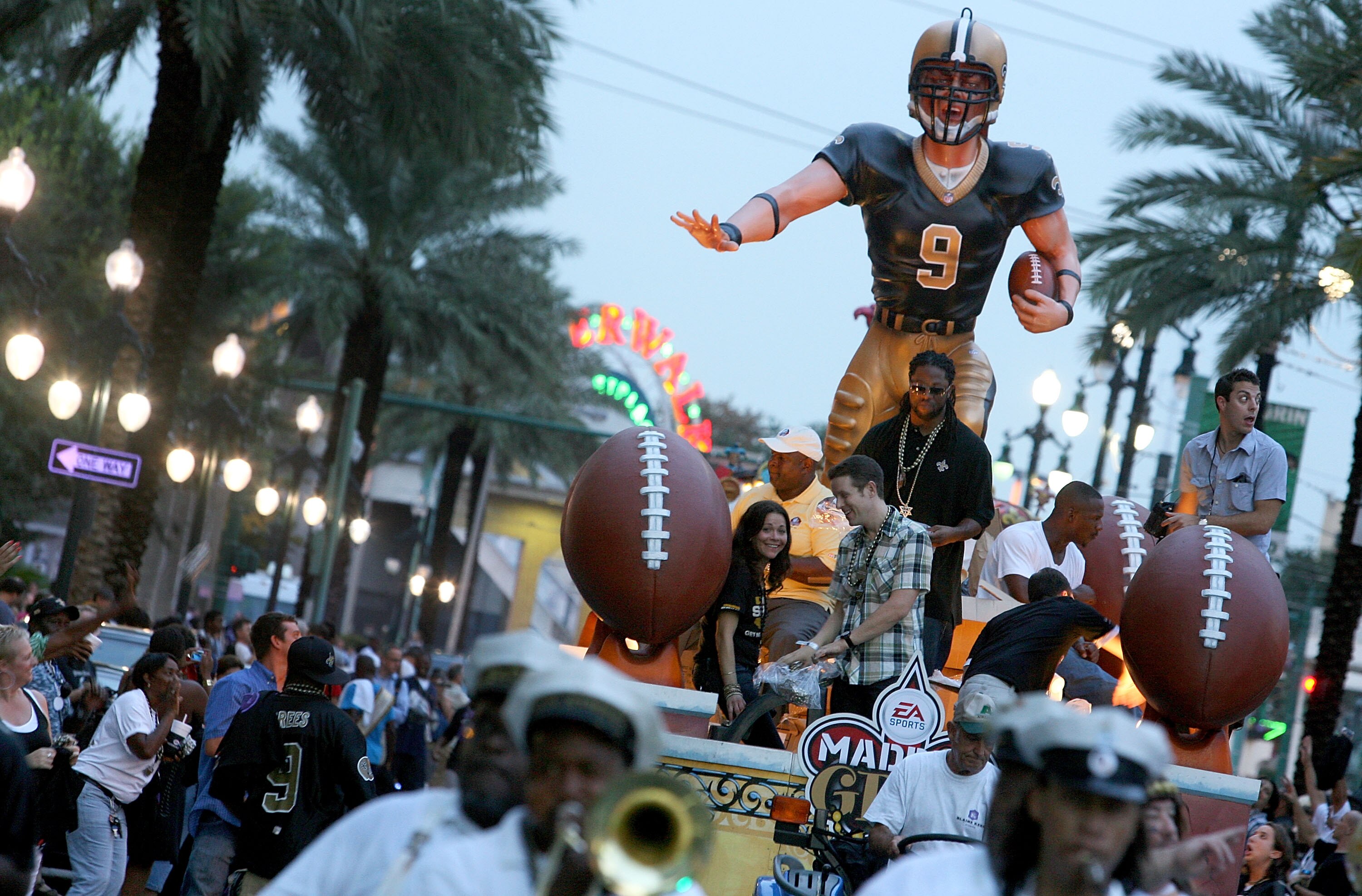 NEW ORLEANS - AUGUST 09: Former New Orleans Saints cornerback Mike McKenzie rides on a float through the streets of New Orleans during Madden Gras, celebrating the launch of EA SPORTS Madden NFL 11 video game on August 9, 2010 in New Orleans, Louisiana. T