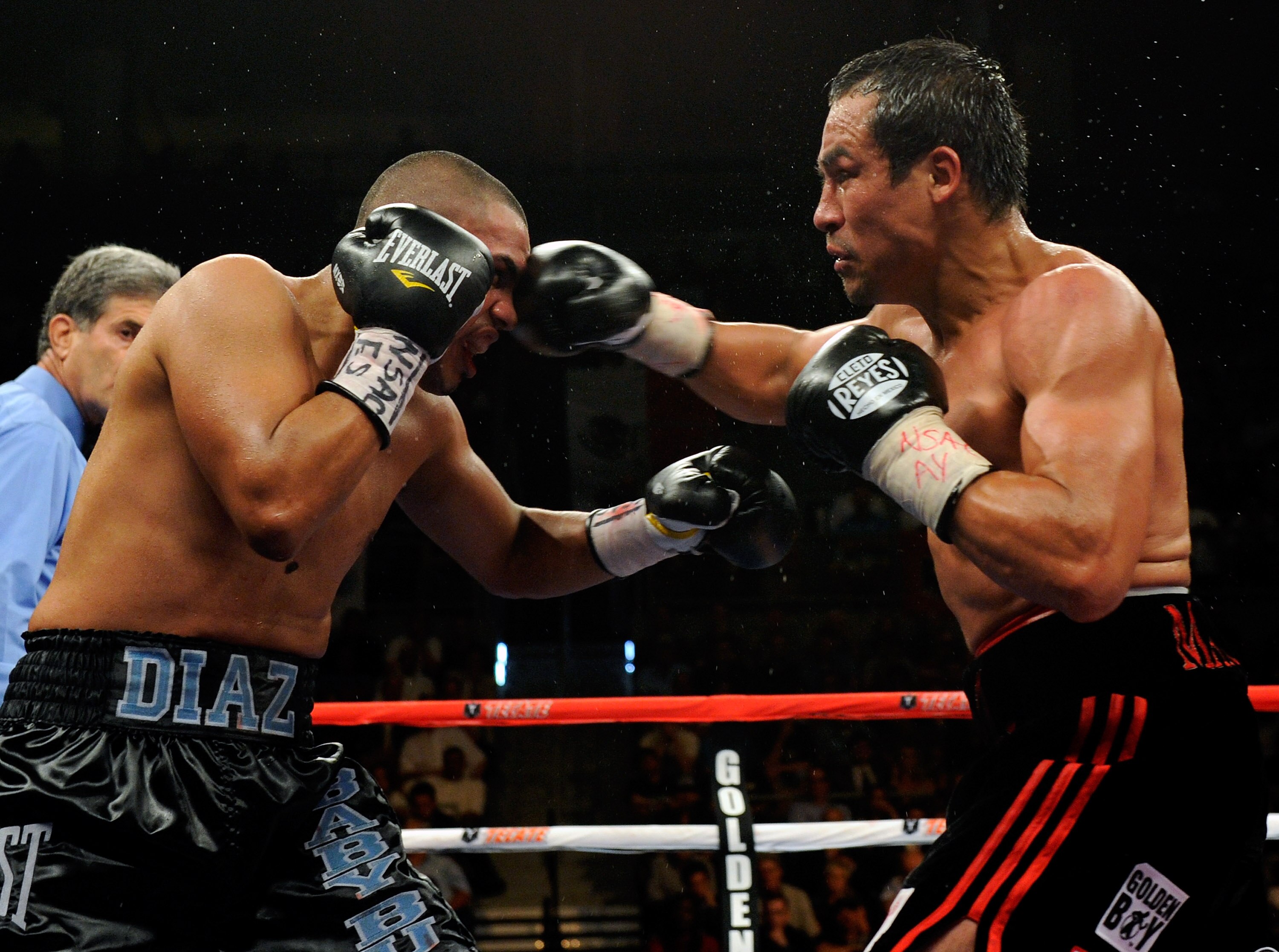 LAS VEGAS - JULY 31:  WBA/WBO lightweight champion Juan Manuel Marquez (R) hits Juan Diaz in the ninth round of their bout at the Mandalay Bay Events Center July 31, 2010 in Las Vegas, Nevada. Marquez retained his WBA and WBO lightweight championship belt
