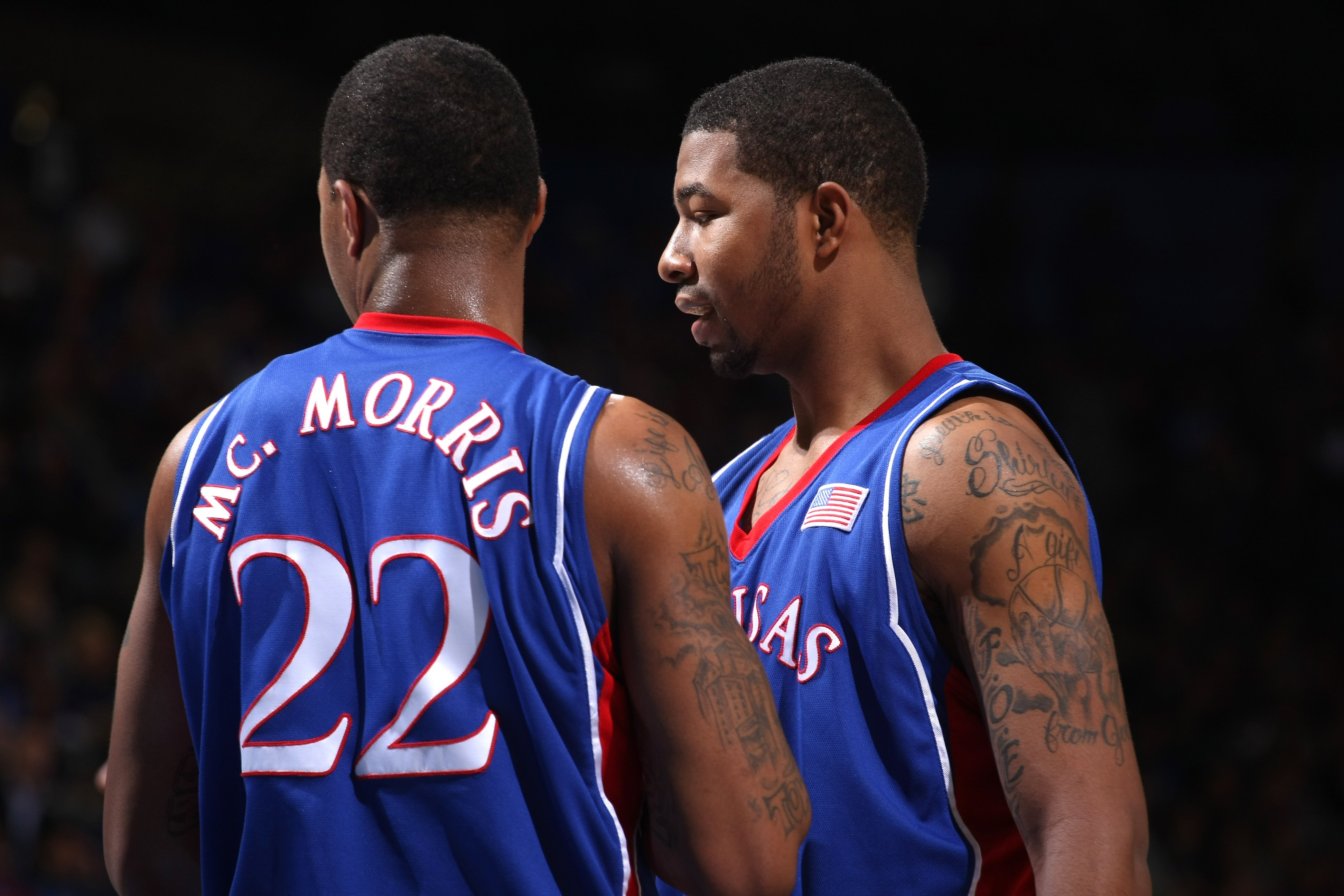 WESTWOOD, CA - DECEMBER 6:   Markieff Morris #21 and Marcus Morris #22 of the Kansas Jayhawks confer during the game with the UCLA Bruins on December 6, 2009 at Pauley Pavillion in Westwood, California.  Kansas won 73-61.   (Photo by Stephen Dunn/Getty Im