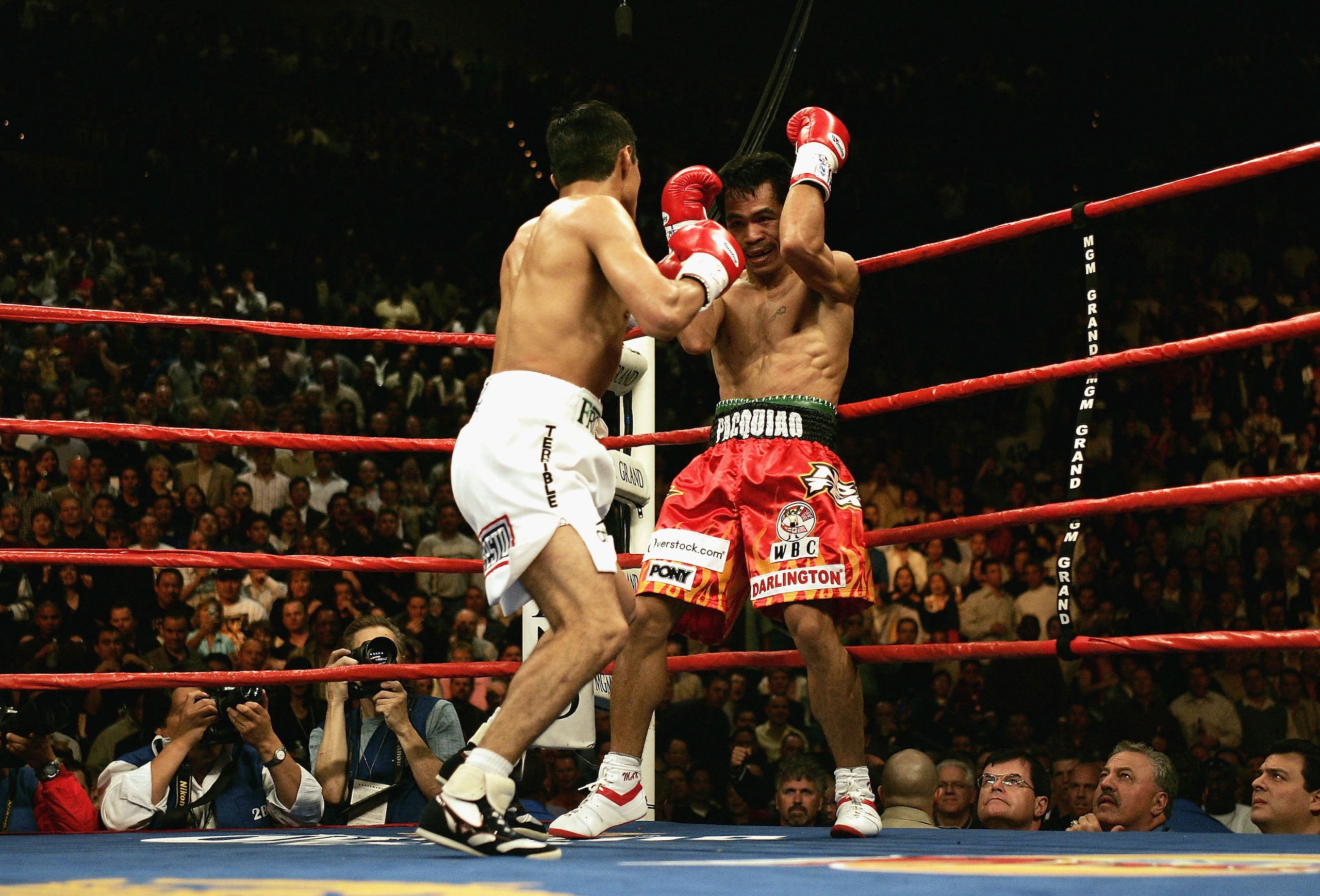 LAS VEGAS, NV - MARCH 19: Erik Morales of Mexico backs Manny Pacquiao of the Phillipines into the corne during Morales' 15-13 unanimous decision win over Pacquiao during their World Super Feather-Weight Championship at the MGM Grand Hotel on March 19, 20 LAS VEGAS, NV - MARCH 19: Erik Morales of Mexico backs Manny Pacquiao of the Phillipines into the corne during Morales' 15-13 unanimous decision win over Pacquiao during their World Super Feather-Weight Championship at the MGM Grand Hotel on March 19, 20