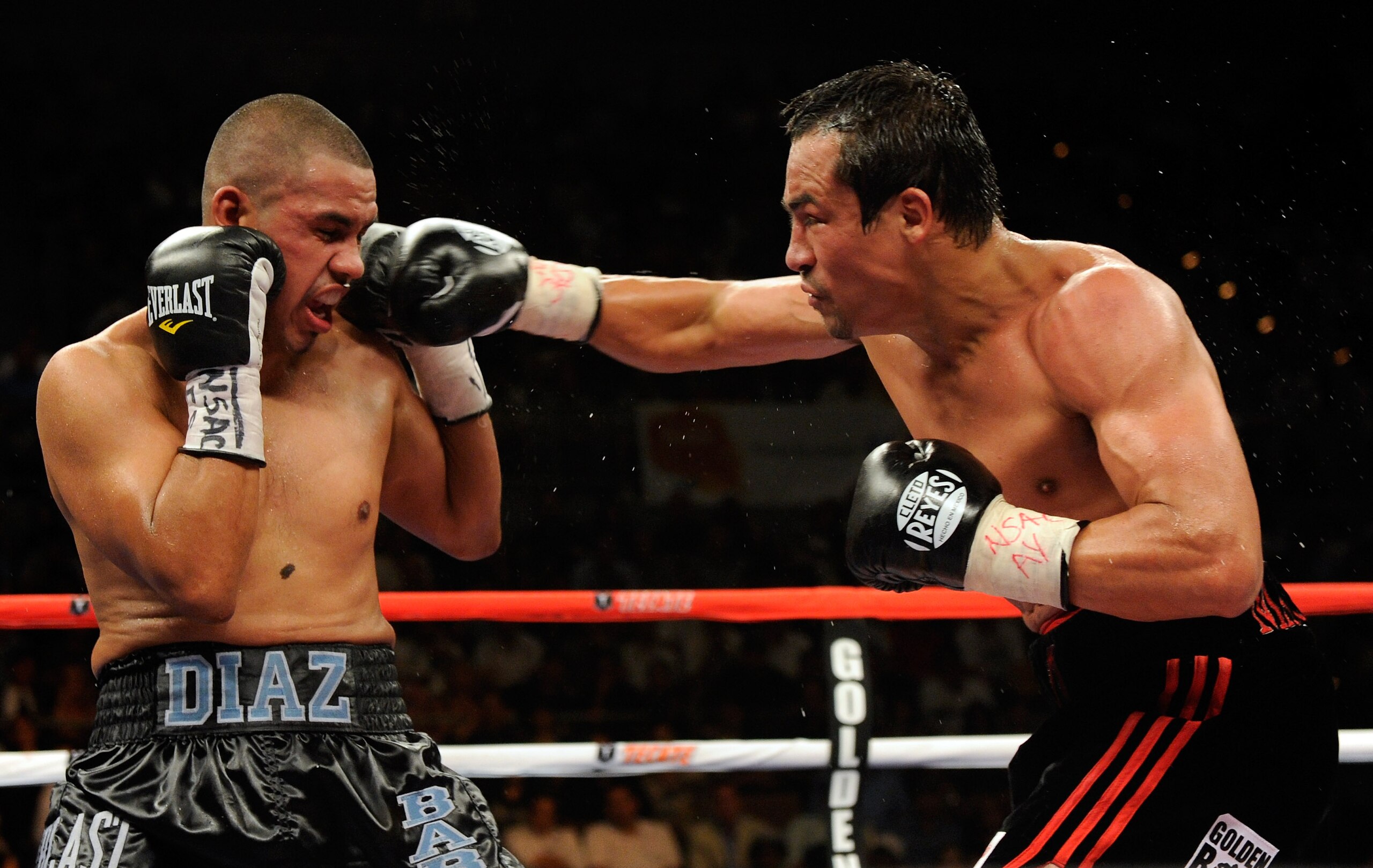 LAS VEGAS - JULY 31: WBA/WBO lightweight champion Juan Manuel Marquez (R) hits Juan Diaz in the eighth round of their bout at the Mandalay Bay Events Center July 31, 2010 in Las Vegas, Nevada. Marquez retained his WBA and WBO lightweight championship bel LAS VEGAS - JULY 31: WBA/WBO lightweight champion Juan Manuel Marquez (R) hits Juan Diaz in the eighth round of their bout at the Mandalay Bay Events Center July 31, 2010 in Las Vegas, Nevada. Marquez retained his WBA and WBO lightweight championship bel