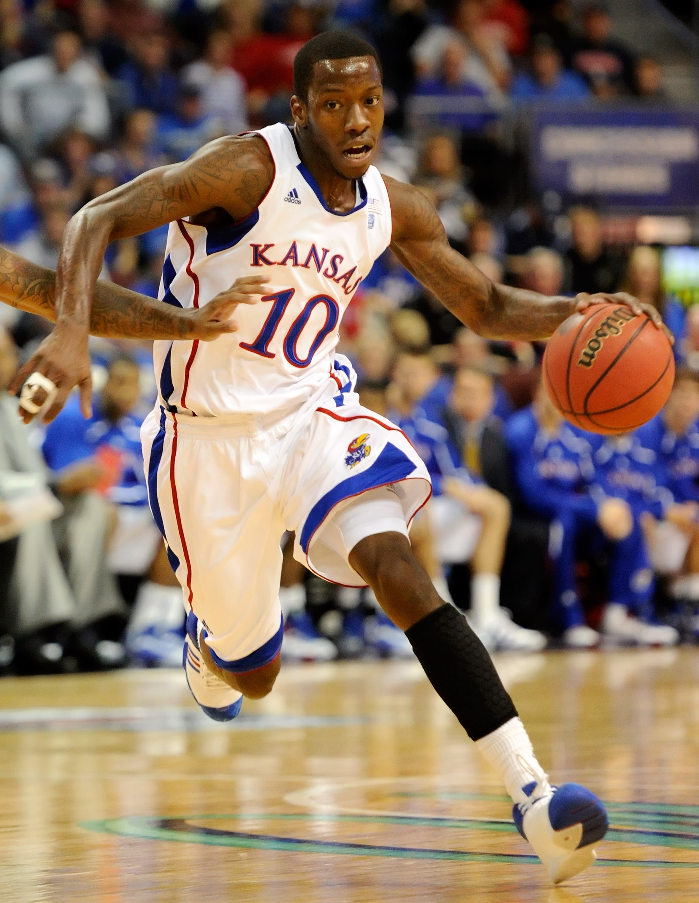 LAS VEGAS - NOVEMBER 27:  Tyshawn Taylor #10 of the Kansas Jayhawks brings the ball up the court against the Arizona Wildcats during the championship game of the Las Vegas Invitational at The Orleans Arena November 27, 2010 in Las Vegas, Nevada. Kansas wo