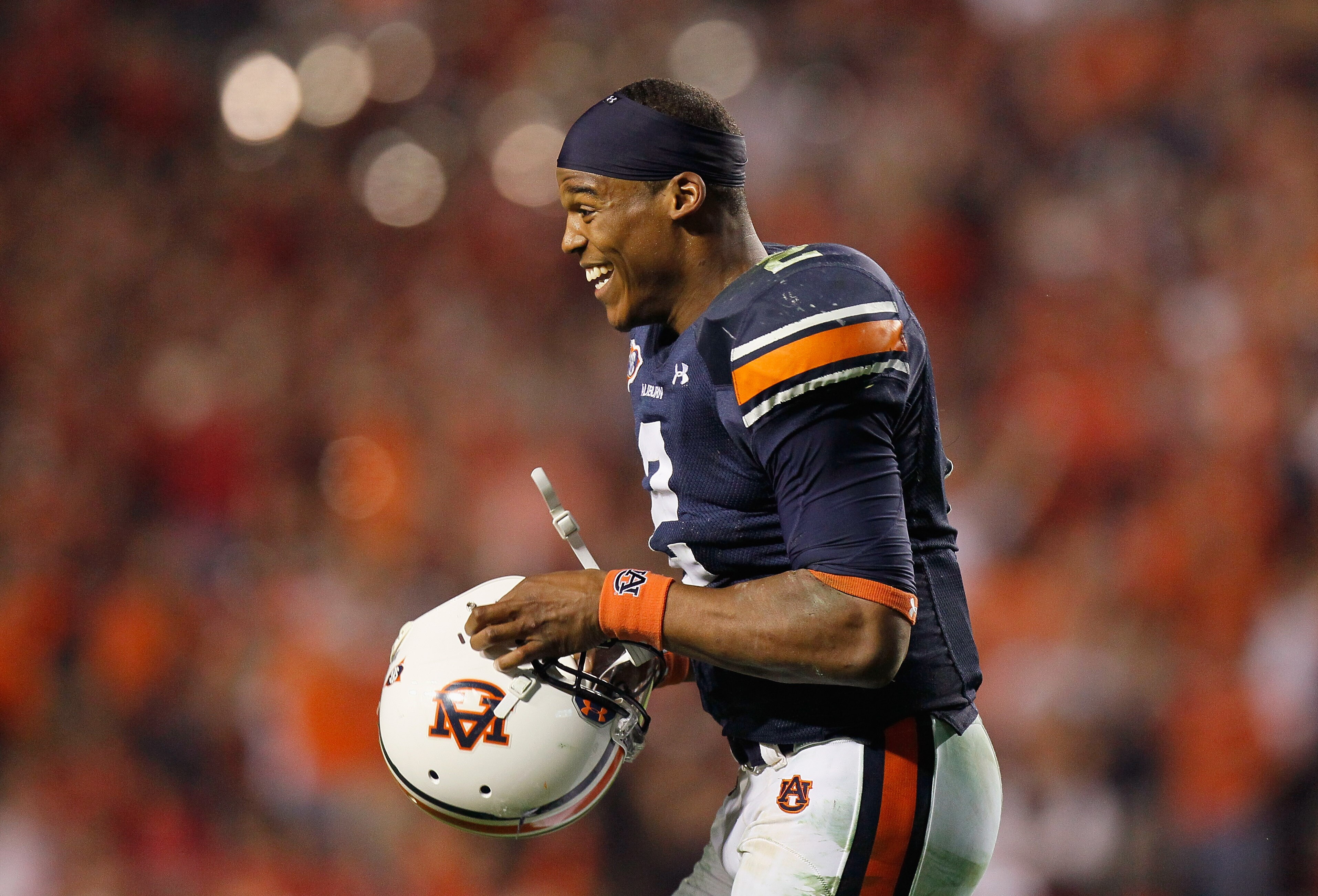 AUBURN, AL - NOVEMBER 13:  Quarterback Cameron Newton #2 of the Auburn Tigers celebrates after an official review showed Newton crossed the end zone after diving for a touchdown against the Georgia Bulldogs at Jordan-Hare Stadium on November 13, 2010 in A