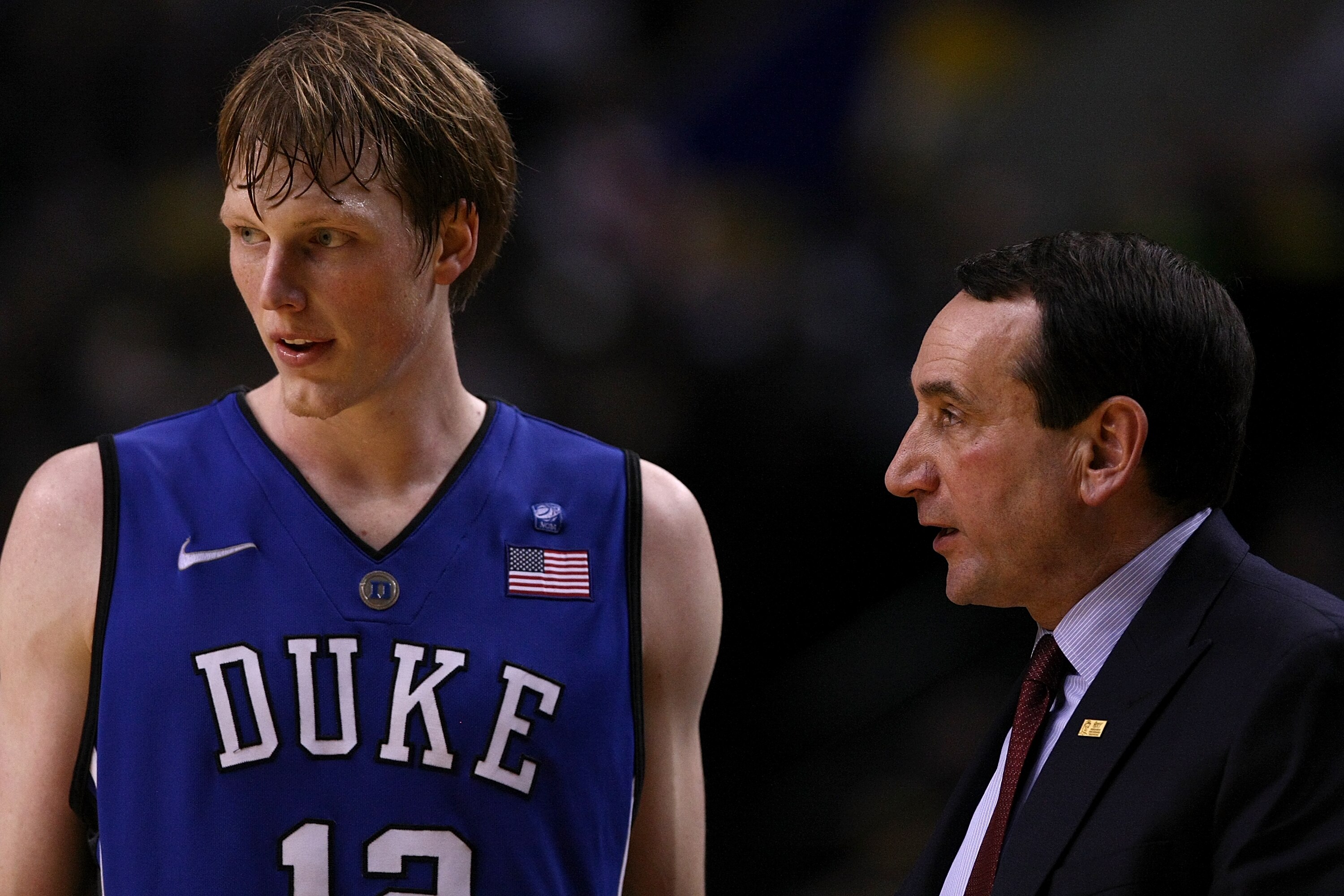 PORTLAND, OR - NOVEMBER 27:  Head Coach Mike Krzyzewski of the Duke Blue Devils talks Kyle Singler #12 against the Oregon Ducks on November 27, 2010 at the Rose Garden in Portland, Oregon.  (Photo by Jonathan Ferrey/Getty Images)