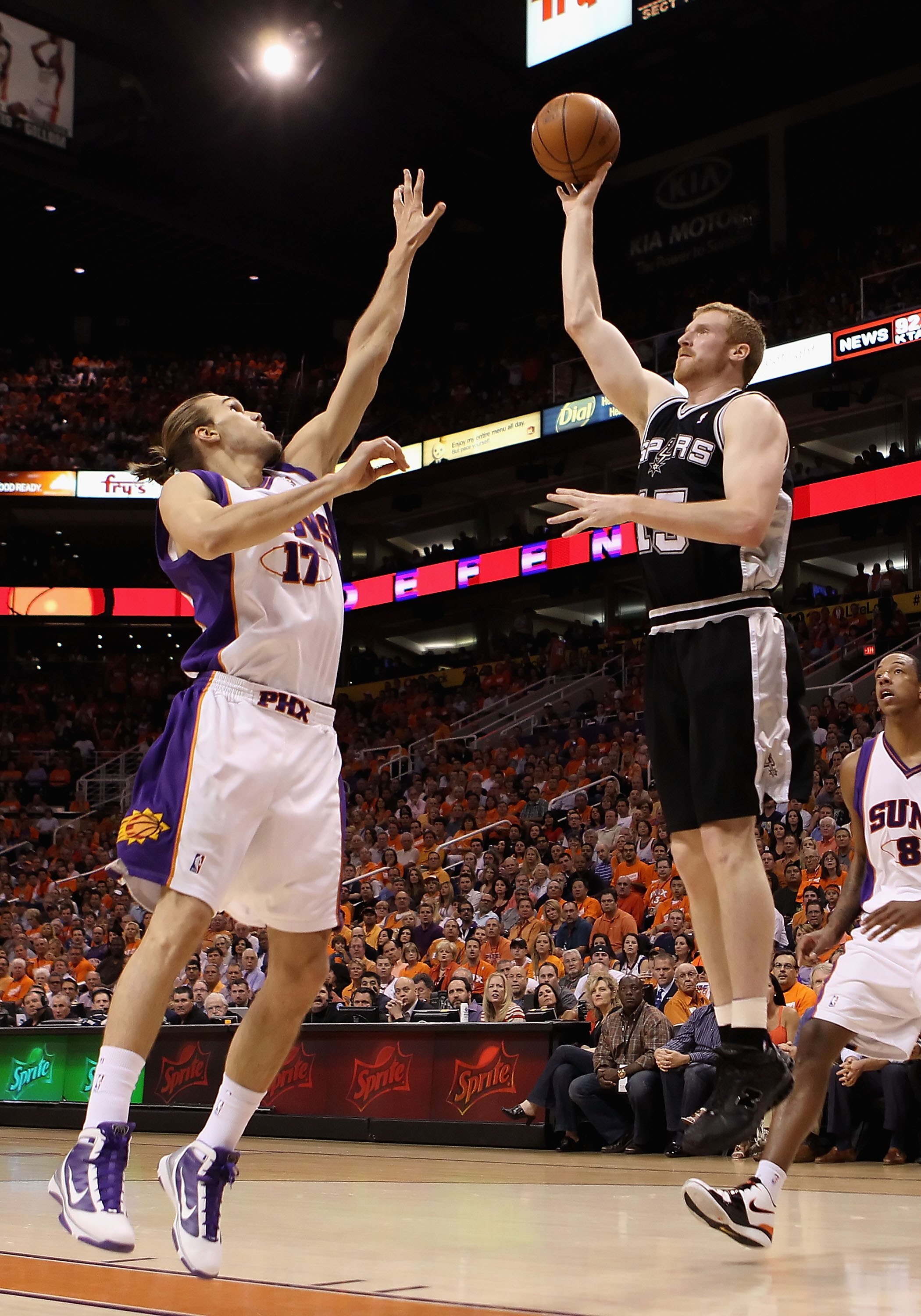 PHOENIX - MAY 03:  Matt Bonner #15 of the San Antonio Spurs puts up a shot against Louis Amundson #17 of the Phoenix Suns during Game One of the Western Conference Semifinals of the 2010 NBA Playoffs at US Airways Center on May 3, 2010 in Phoenix, Arizona