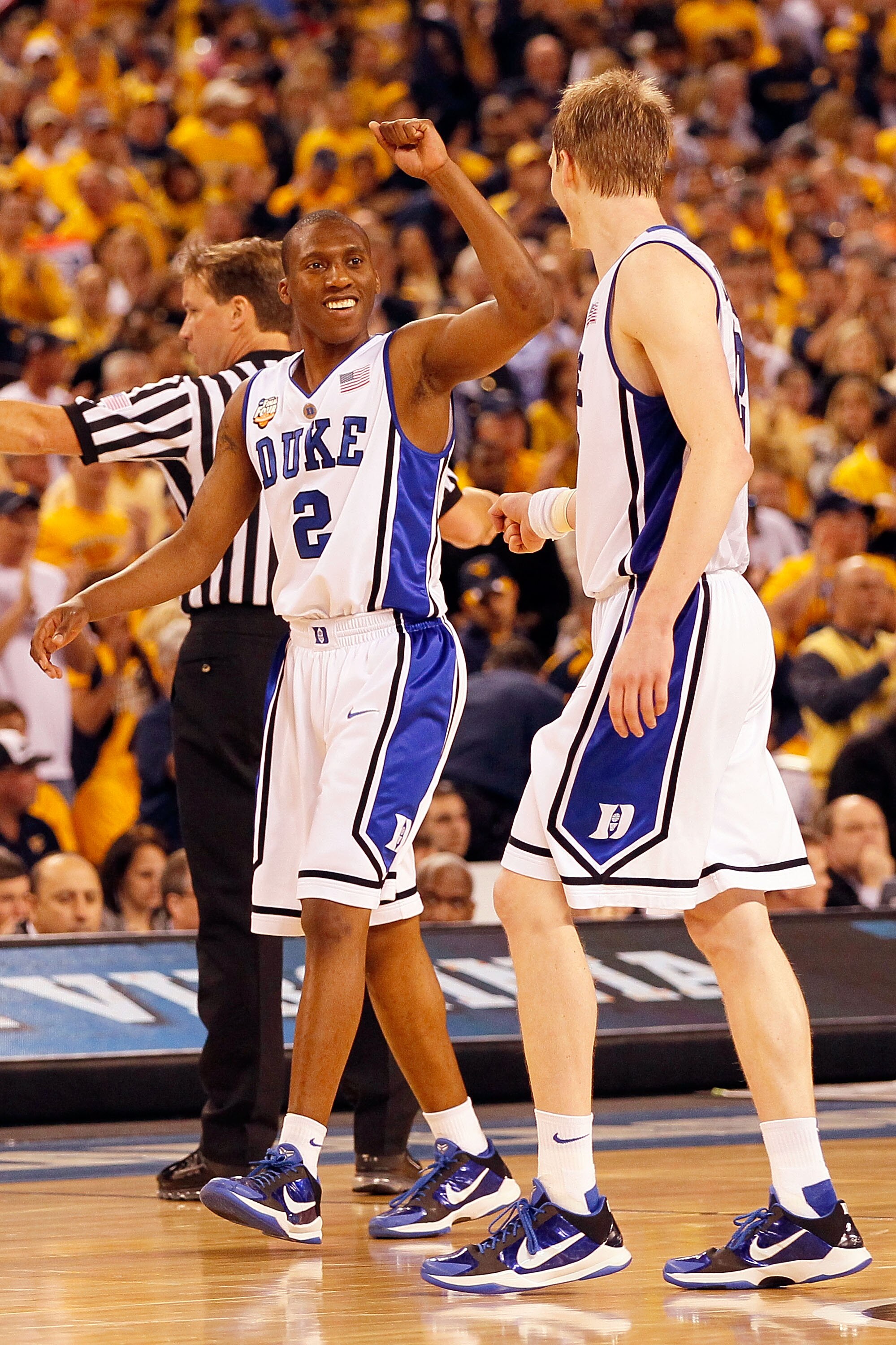 INDIANAPOLIS - APRIL 03:  Nolan Smith #2 of the Duke Blue Devils reacts with teammate Kyle Singler #12 before the Blue Devils defeated the West Virginia Mountaineers 78-57 during the National Semifinal game of the 2010 NCAA Division I Men's Basketball Cha