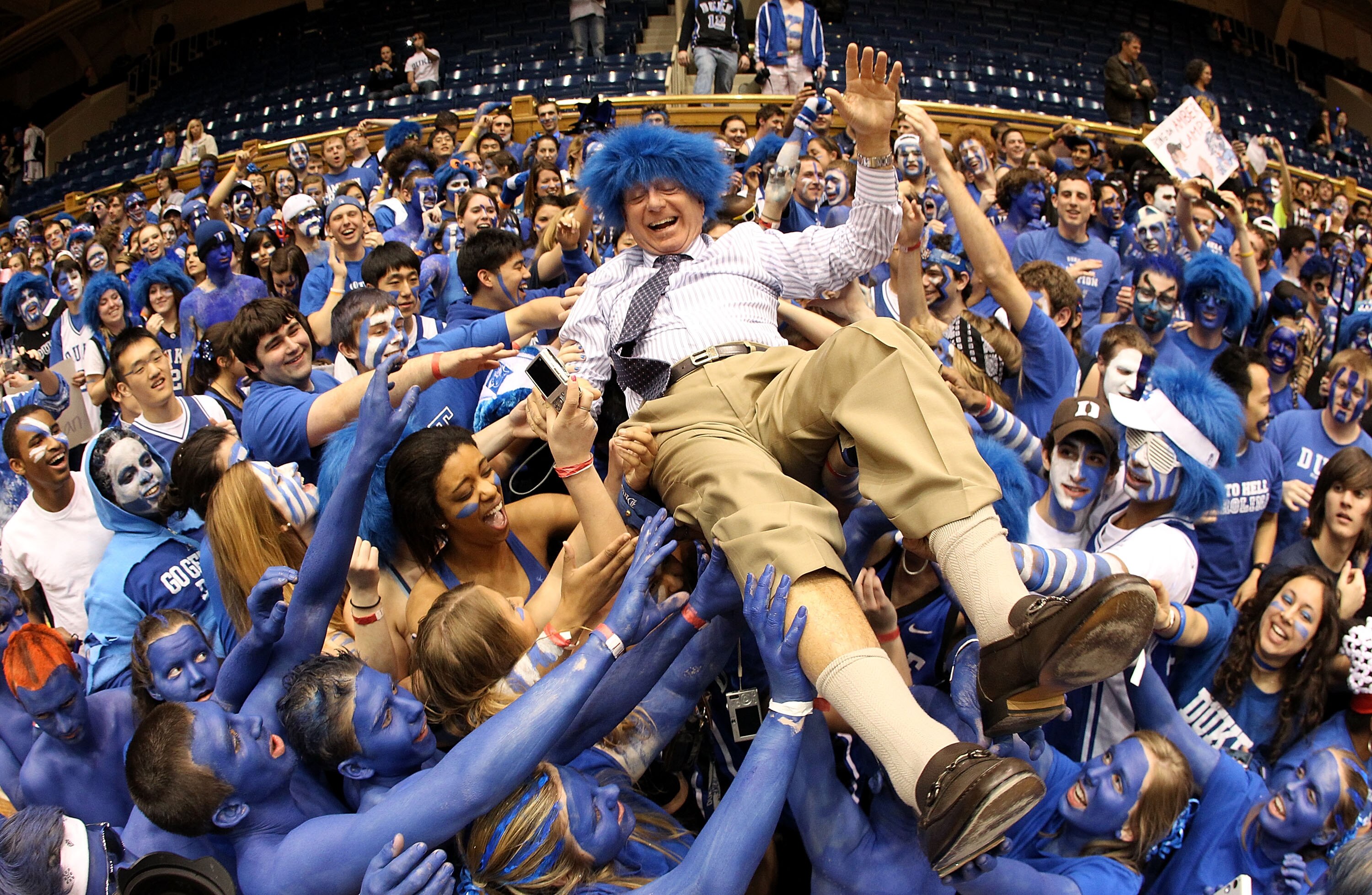 DURHAM, NC - MARCH 06:  ESPN analyst Dick Vitale surfs the crowd with the Cameron Crazies before the start of the game between the North Carolina Tar Heels and Duke Blue Devils at Cameron Indoor Stadium on March 6, 2010 in Durham, North Carolina.  (Photo 