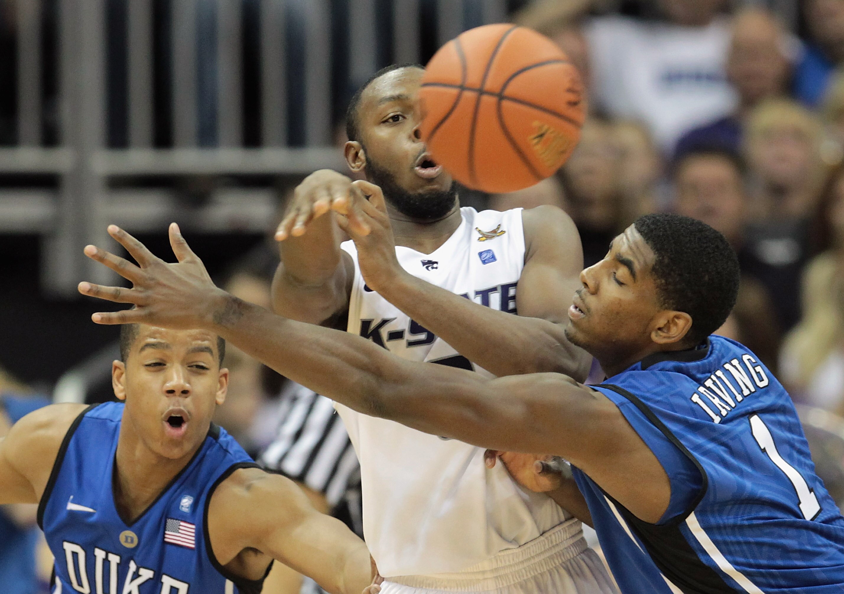 KANSAS CITY, MO - NOVEMBER 23:  Jacob Pullen #0 of the Kansas State Wildcats passes as Kyrie Irving #1 of the Duke Blue Devils defends during the CBE Classic championship game on November 23, 2010 at the Sprint Center in Kansas City, Missouri.  (Photo by 