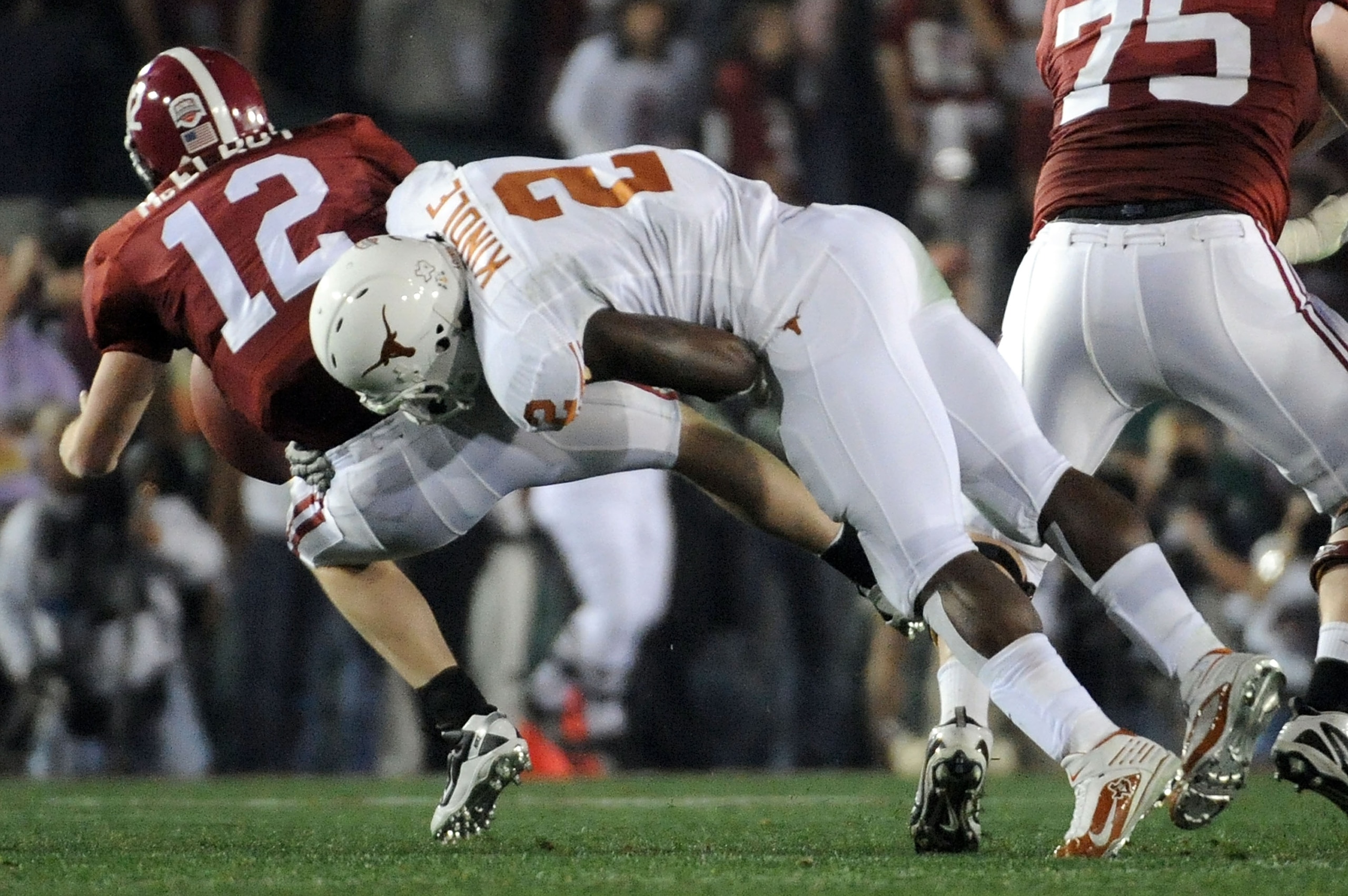 PASADENA, CA - JANUARY 07:  Linebacker Sergio Kindle #2 of the Texas Longhorns sacks quarterback Greg McElroy #12 of the Alabama Crimson Tide during the Citi BCS National Championship game at the Rose Bowl on January 7, 2010 in Pasadena, California.  (Pho
