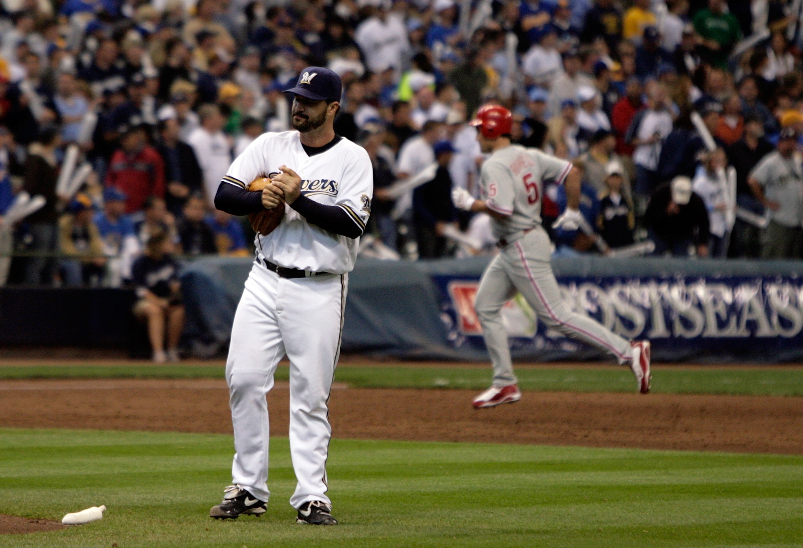 MILWAUKEE - OCTOBER 05:  Jeff Suppan #37 of the Milwaukee Brewers rubs up a new ball after surrendering a third inning three run home run to Pat Burrell #5 of the Philadelphia Phillies in game four of the NLDS during the 2008 MLB playoffs at Miller Park o