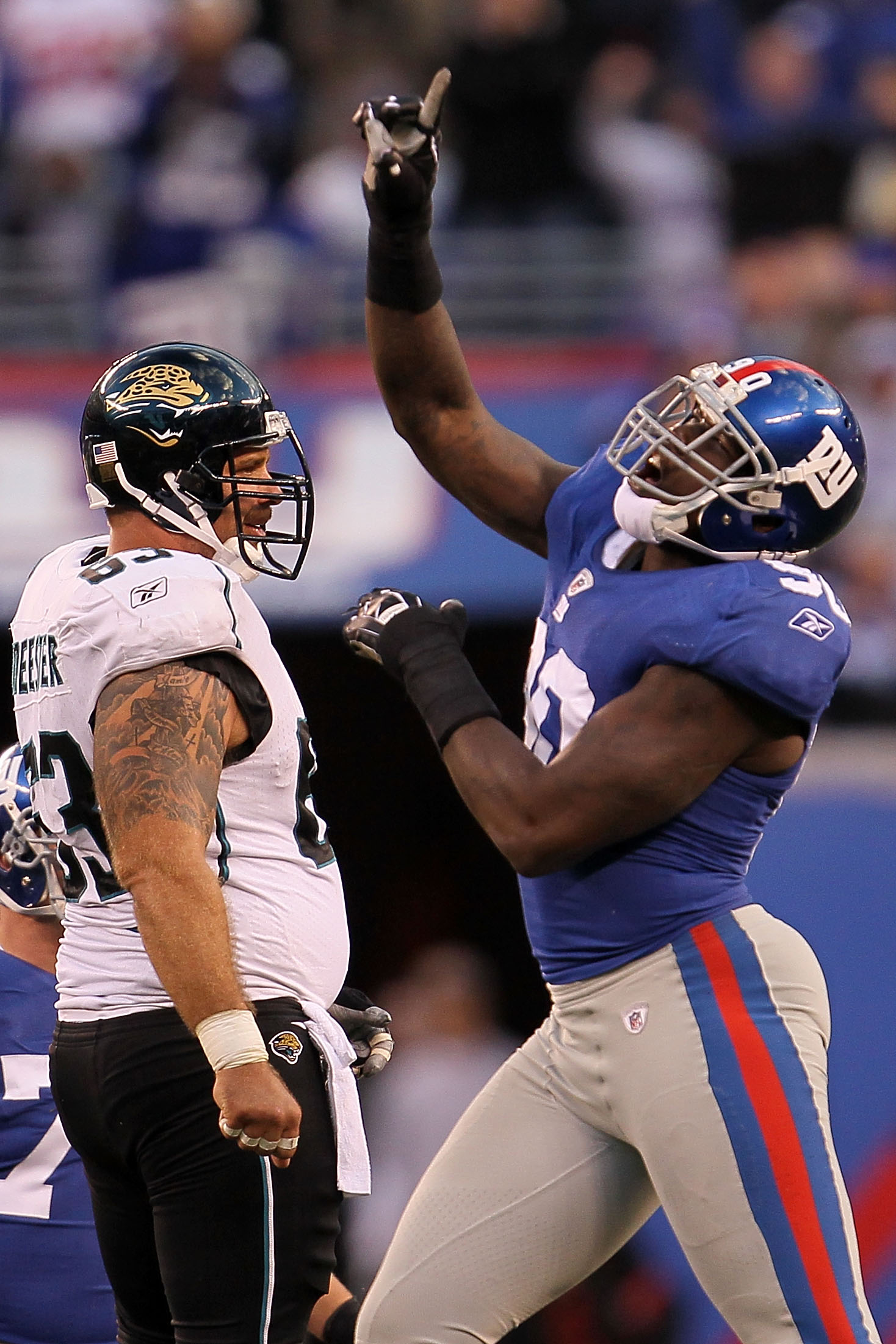 EAST RUTHERFORD, NJ - NOVEMBER 28: Jason Pierre-Paul #90 of the New York Giants celebrates after David Garrard #9 of the Jacksonville Jaguars was sacked at New Meadowlands Stadium on November 28, 2010 in East Rutherford, New Jersey.  (Photo by Chris McGra