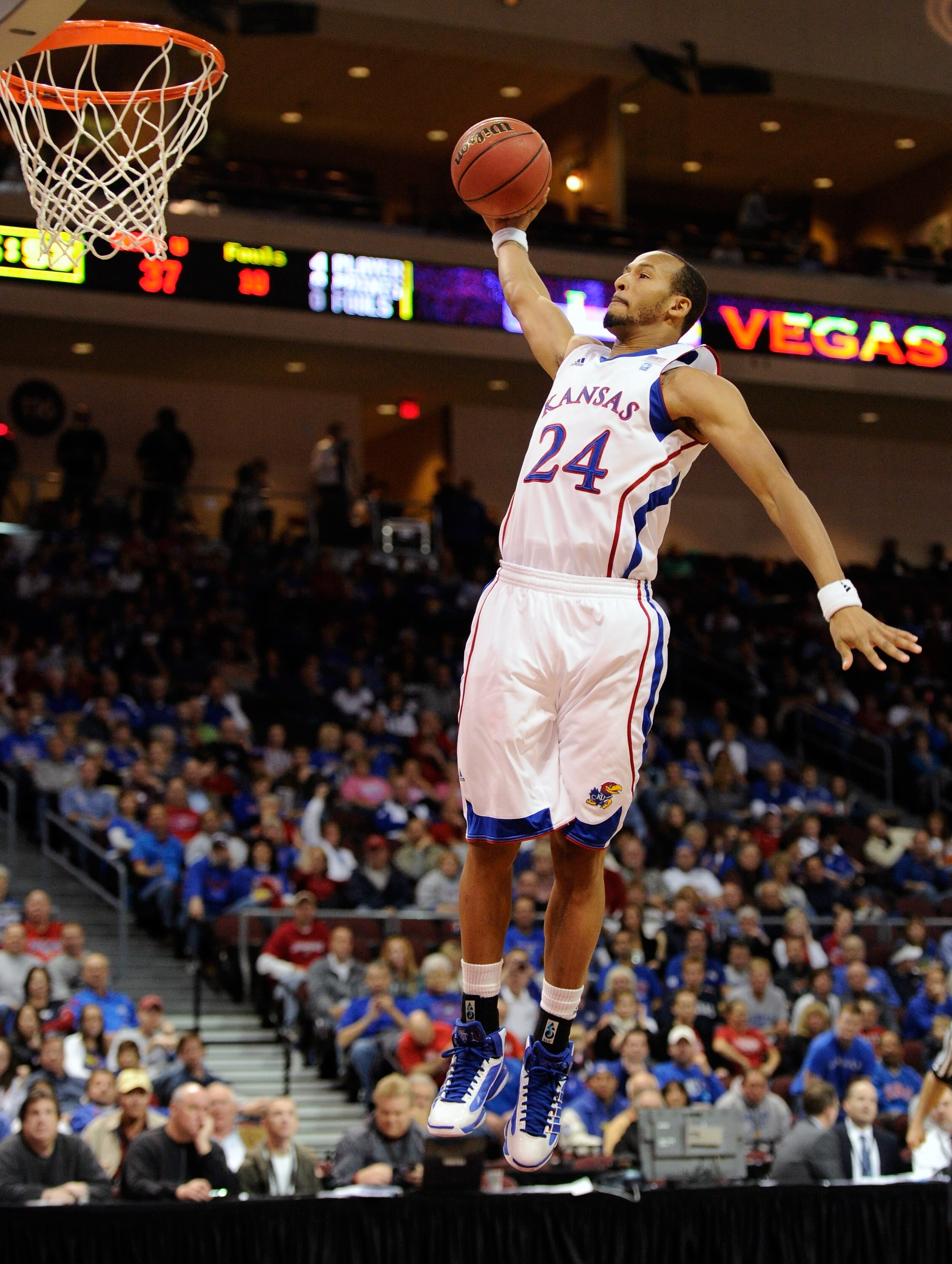 LAS VEGAS - NOVEMBER 26:  Travis Releford #24 of the Kansas Jayhawks swoops in for a breakaway dunk against the Ohio Bobcats during the third round of the Las Vegas Invitational at The Orleans Arena November 26, 2010 in Las Vegas, Nevada. Kansas won 98-41