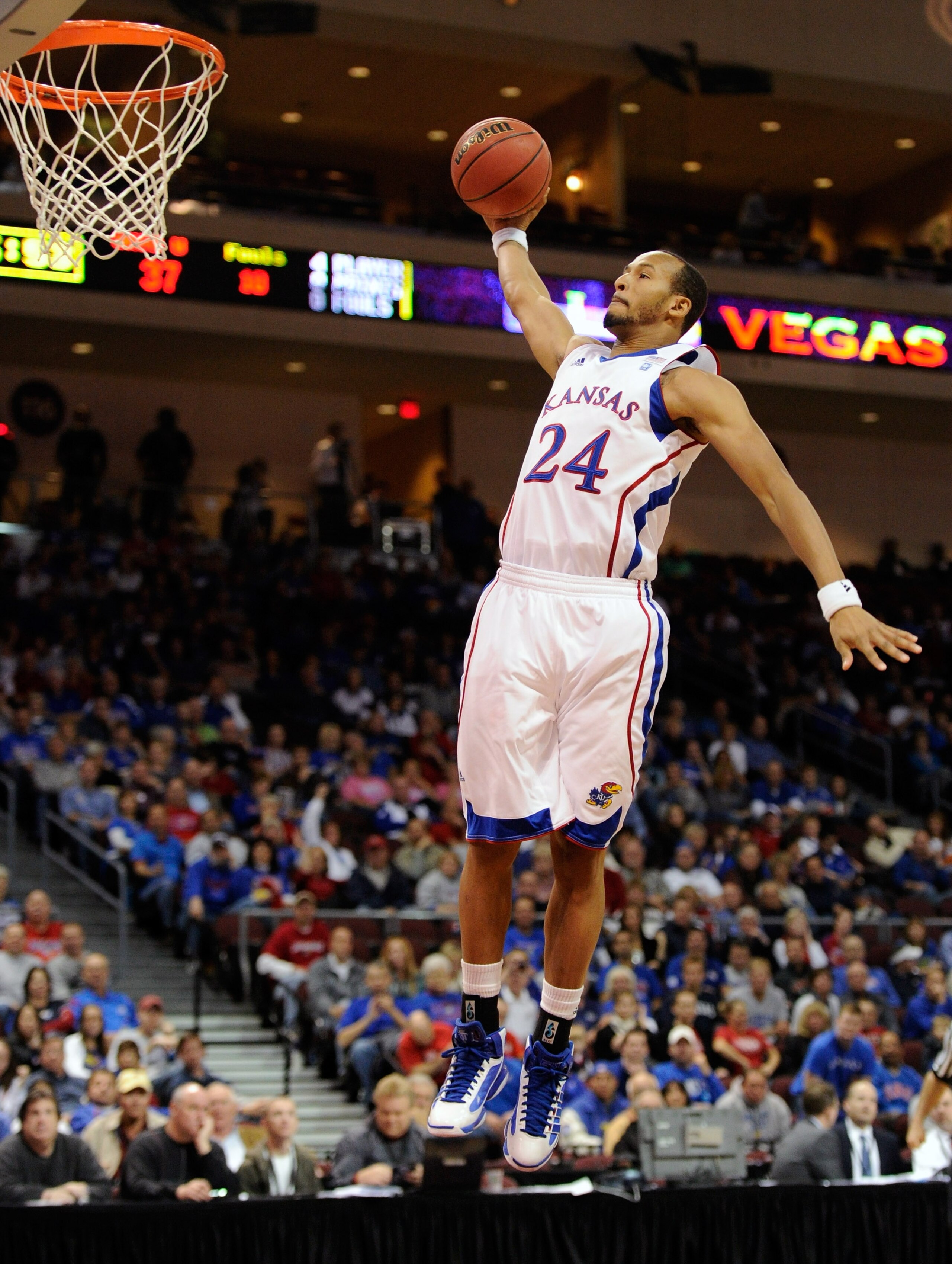 LAS VEGAS - NOVEMBER 26:  Travis Releford #24 of the Kansas Jayhawks swoops in for a breakaway dunk against the Ohio Bobcats during the third round of the Las Vegas Invitational at The Orleans Arena November 26, 2010 in Las Vegas, Nevada. Kansas won 98-41