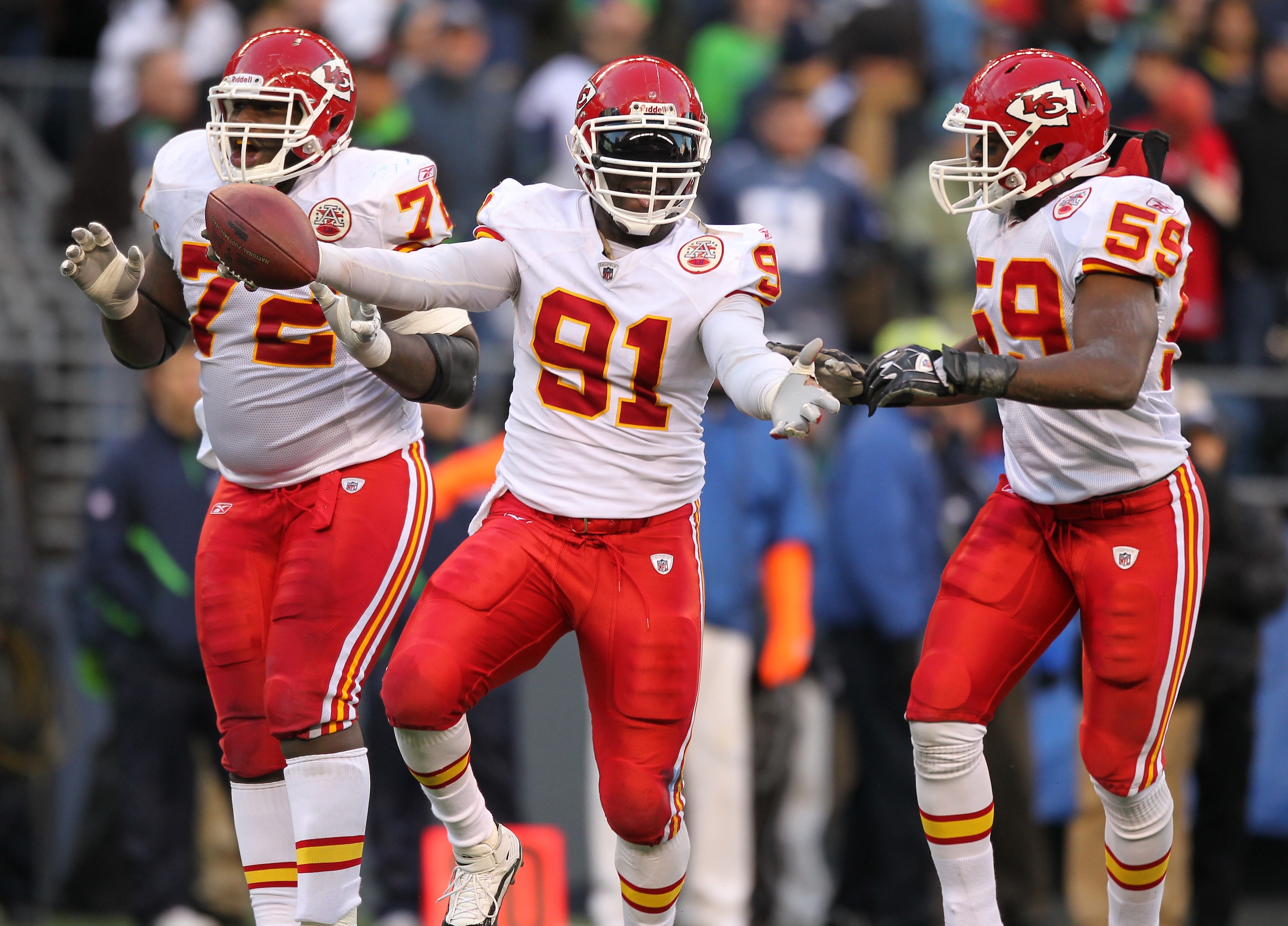 SEATTLE, WA - NOVEMBER 28: Linebacker Tamba Hali #91 of the Kansas City Chiefs celebrates with Glenn Dorsey #72 and Jovan Belcher #59 after recovering a fumble on a sack of quarterback Matt Hasselbeck of the Seattle Seahawks at Qwest Field on November 28 SEATTLE, WA - NOVEMBER 28: Linebacker Tamba Hali #91 of the Kansas City Chiefs celebrates with Glenn Dorsey #72 and Jovan Belcher #59 after recovering a fumble on a sack of quarterback Matt Hasselbeck of the Seattle Seahawks at Qwest Field on November 28