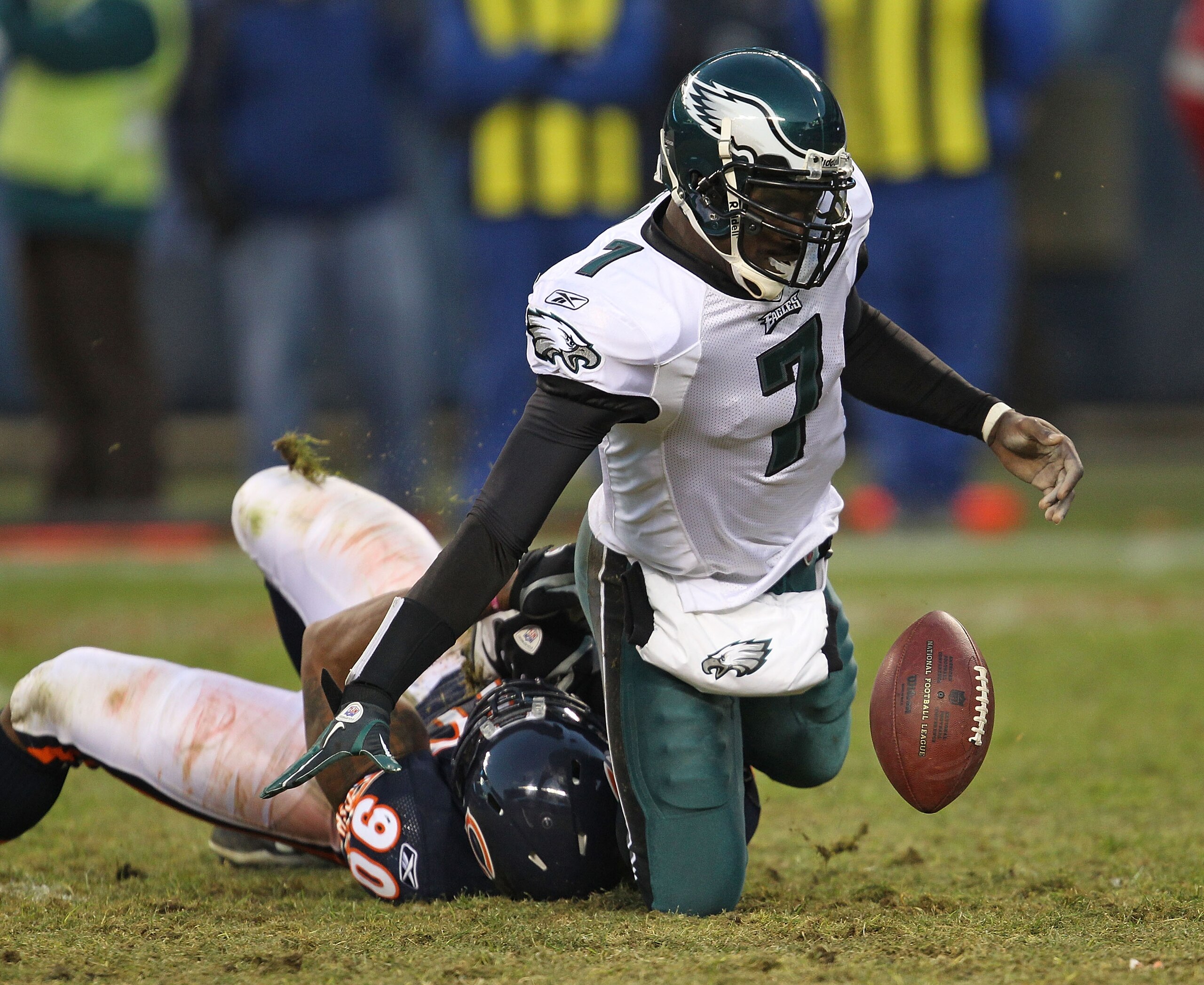 CHICAGO - NOVEMBER 28: Michael Vick #7 of the Philadelphia Eagles fumbles the ball as he is sacked by Julius Peppers #90 of the Chicago Bears at Soldier Field on November 28, 2010 in Chicago, Illinois. The Bears defeated the Eagles 31-26. (Photo by Jonath