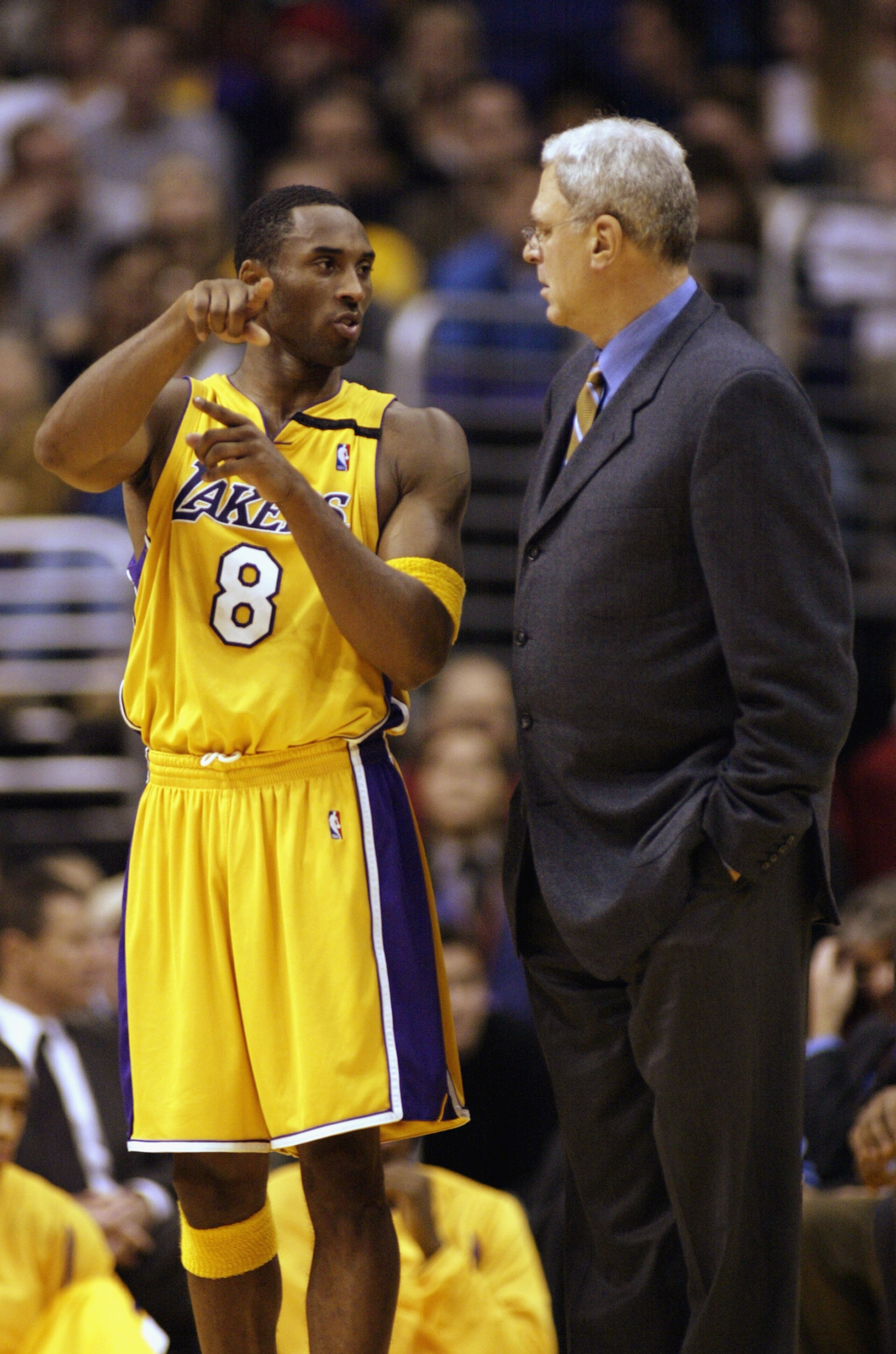 LOS ANGELES - NOVEMBER 12:  Kobe Bryant #8 of the Los Angeles Lakers talks with head coach Phil Jackson during the game against the Atlanta Hawks at Staples Center on November 12, 2002 in Los Angeles, California.  The Hawks won 95-83.  NOTE TO USER: User