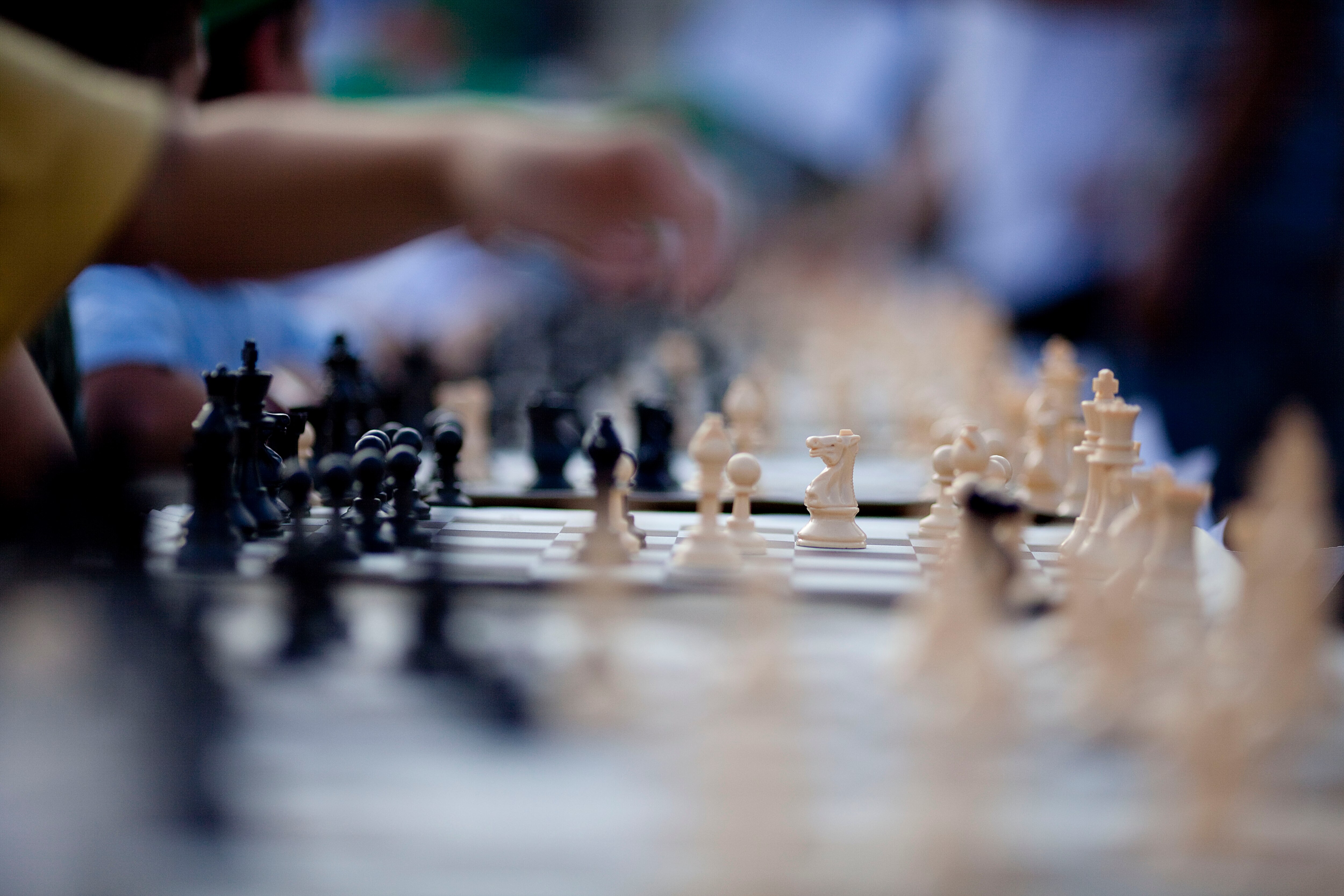 TEL AVIV, ISRAEL - OCTOBER 21: (ISRAEL OUT) A Israeli chess player makes a move against Grandmaster Alik Gershon, during an attempt to break the Guinness world record of simultaneous chess play on October 21, 2010 in Tel Aviv, Israel. Hundreds of chess pl