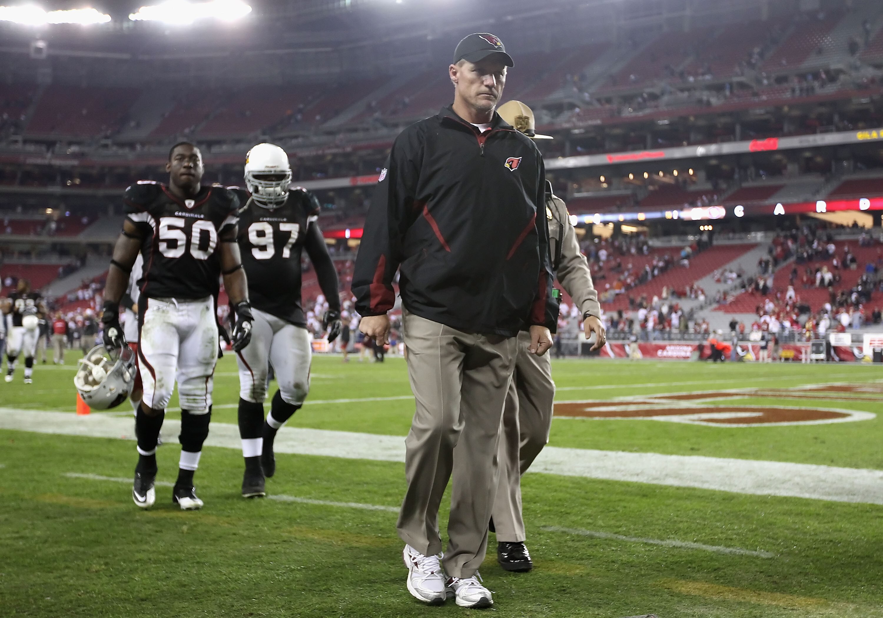 GLENDALE, AZ - NOVEMBER 29:  Head coach Ken Whisenhunt of the Arizona Cardinals walks off the field following the NFL game against the San Francisco 49ers at the University of Phoenix Stadium on November 29, 2010 in Glendale, Arizona. The 49ers defeated t