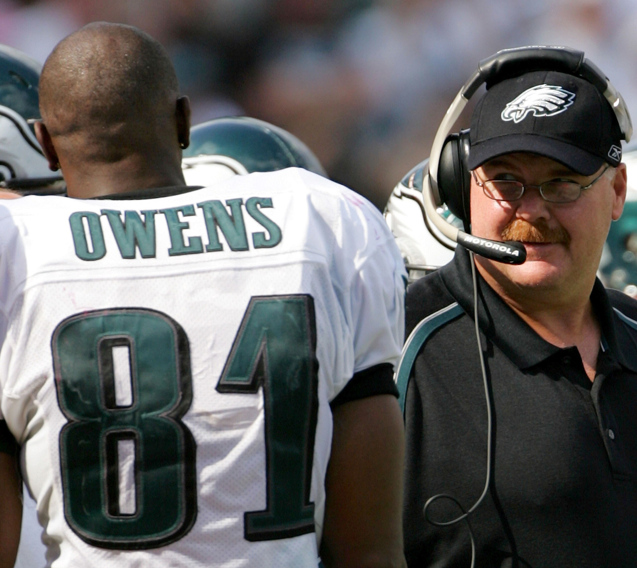 PHILADELPHIA - SEPTEMBER 18:  Head coach Andy Reid of the Philadelphia Eagles speaks with receiver Terrell Owens #81 on the sidelines during the second half of the game against the San Francisco 49ers on September 18, 2005 at Lincoln Financial Field in Ph