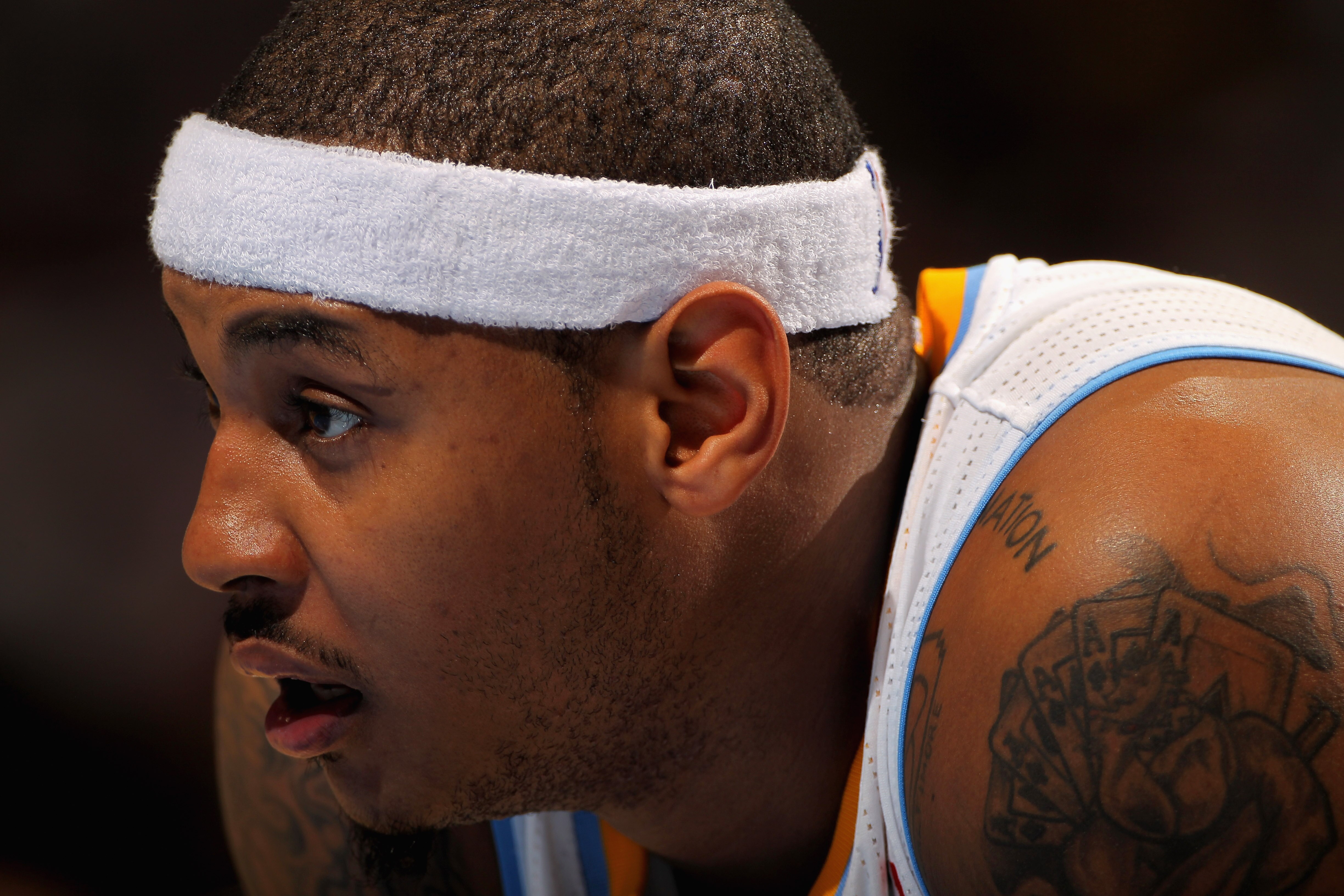 DENVER - NOVEMBER 16:  Carmelo Anthony #15 of the Denver Nuggets looks on during a break in the action against the New York Knicks at the Pepsi Center on November 16, 2010 in Denver, Colorado. The Nuggets defeated the Knicks 120-118. NOTE TO USER: User ex