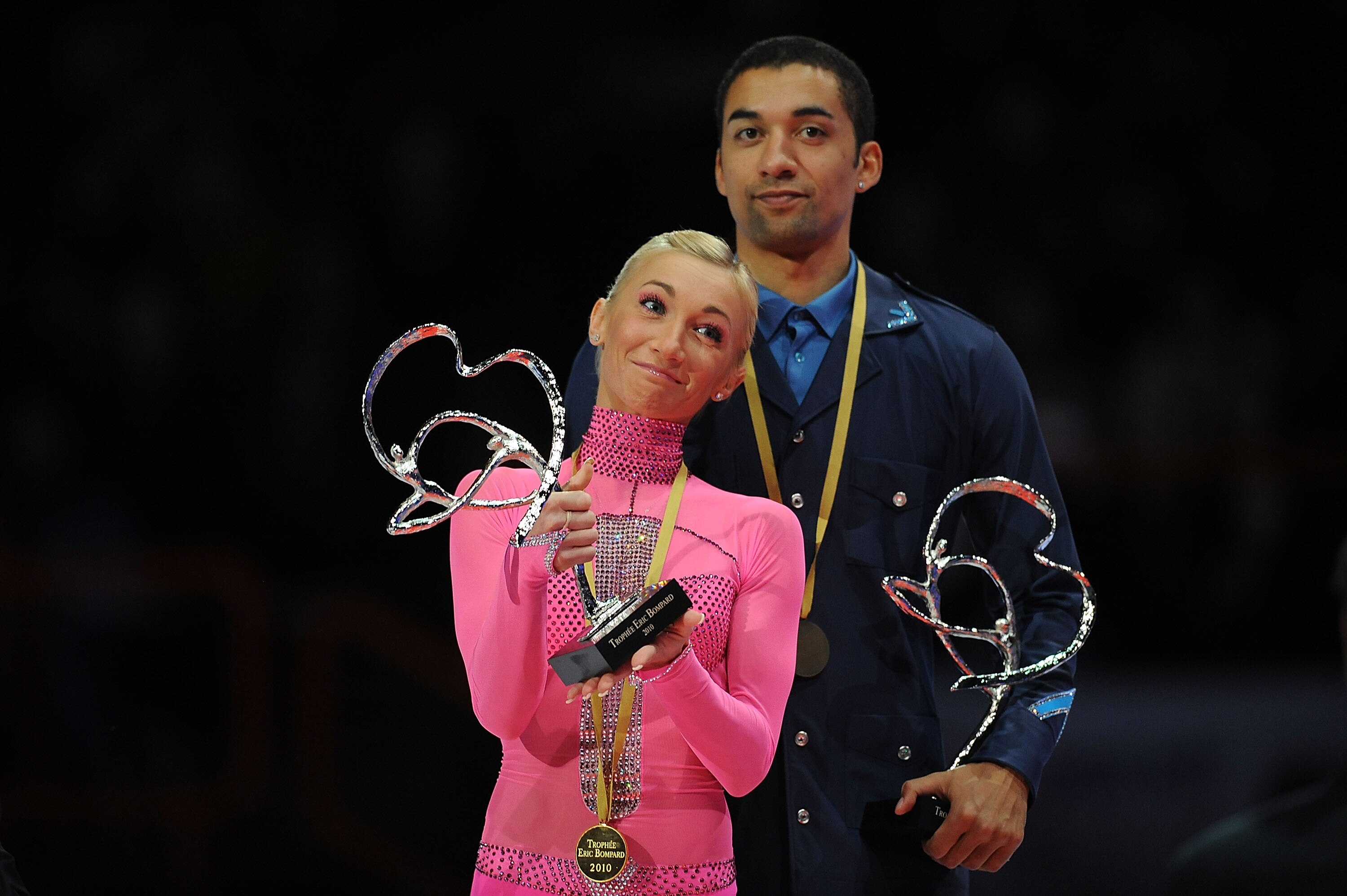 PARIS - NOVEMBER 27:  Aliona Savchenko and Robin Szolkowy of Germany celebrate winning Gold in the Pairs Program during the ISU GP Trophee Eric Bompard 2010 at the Palais omnisport de Paris Bercy on November 27, 2010 in Paris, France.  (Photo by Christoph