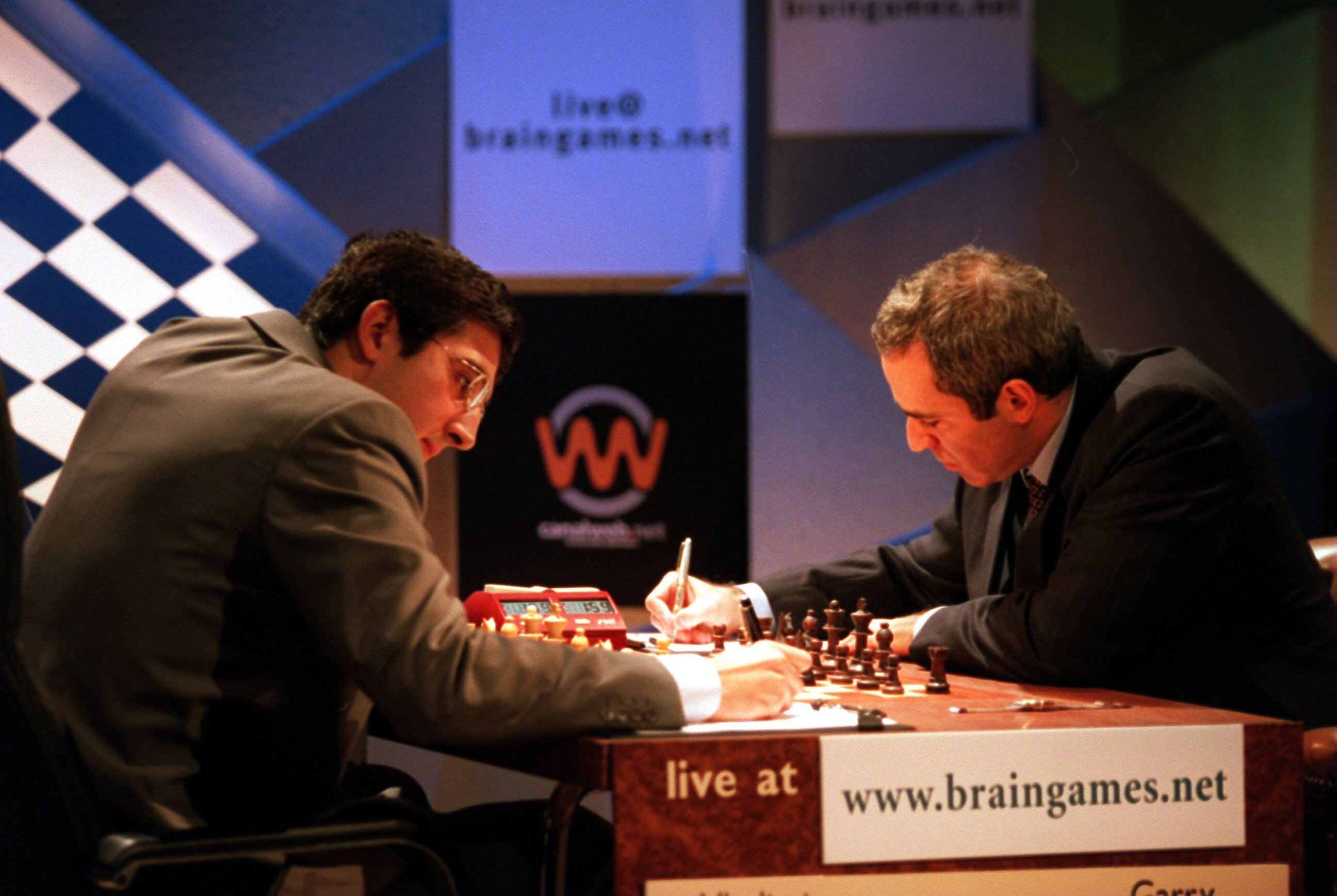 24 Oct 2000:  Vladimir Kramnik of Russia (left) and Garry Kasparov (right) write down their tactics during the World Chess Championships played at the Riverside Studios, London. Mandatory Credit: Andrew Redington/ALLSPORT