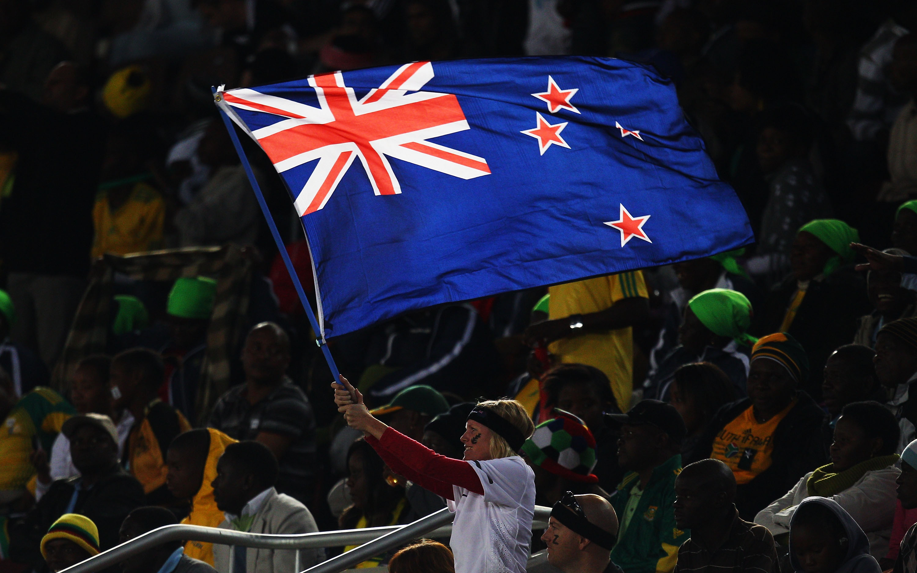 POLOKWANE, SOUTH AFRICA - JUNE 24:  A New Zealand flag waves her national flag during the 2010 FIFA World Cup South Africa Group F match between Paraguay and New Zealand at Peter Mokaba Stadium on June 24, 2010 in Polokwane, South Africa.  (Photo by Camer