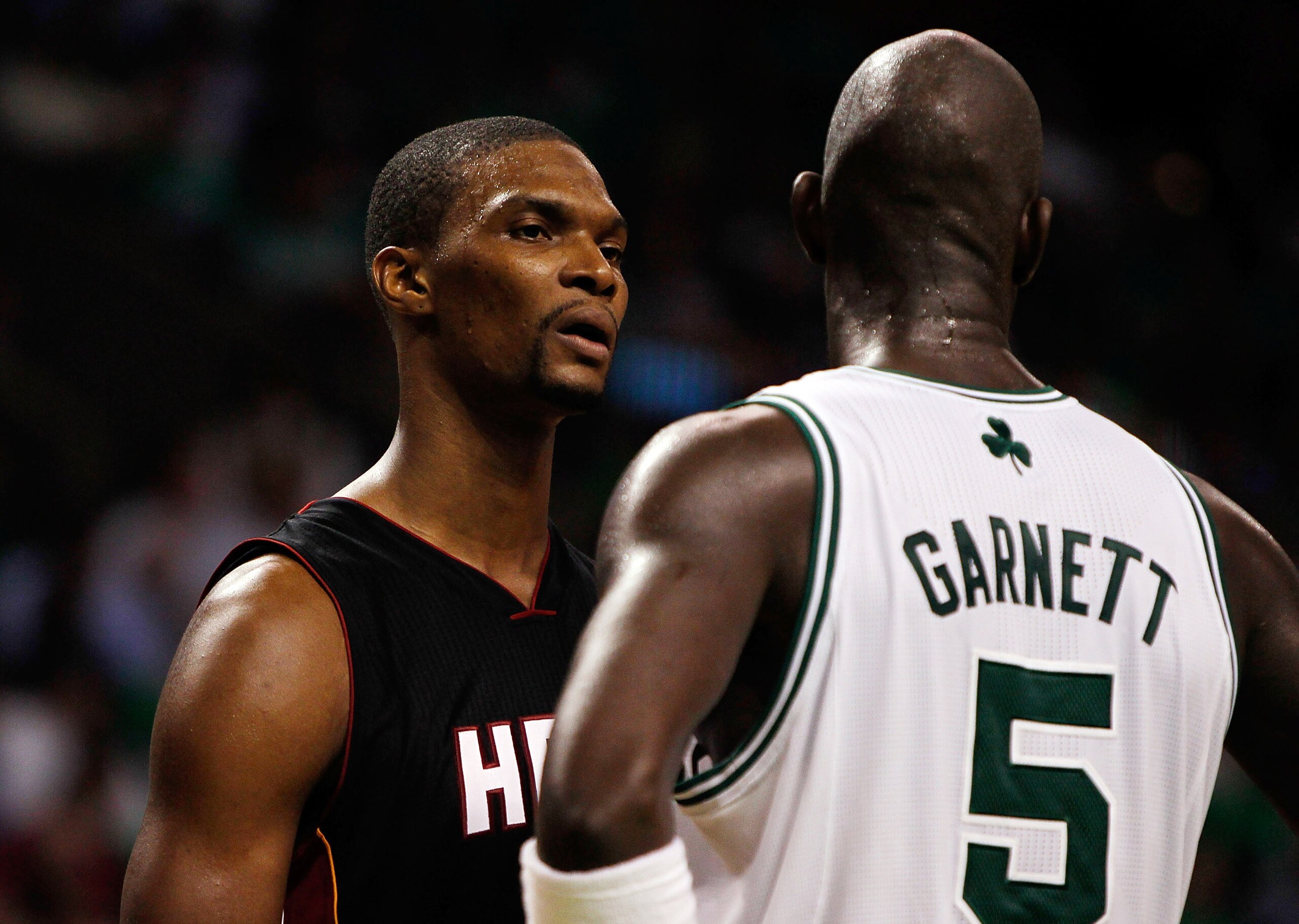 BOSTON, MA - OCTOBER 26: Chris Bosh #1 of the Miami Heat has words with Kevin Garnett #5 of the Boston Celtics at the TD Banknorth Garden on October 26, 2010 in Boston, Massachusetts.  The Heat lost 88-80. NOTE TO USER: User expressly acknowledges and agr