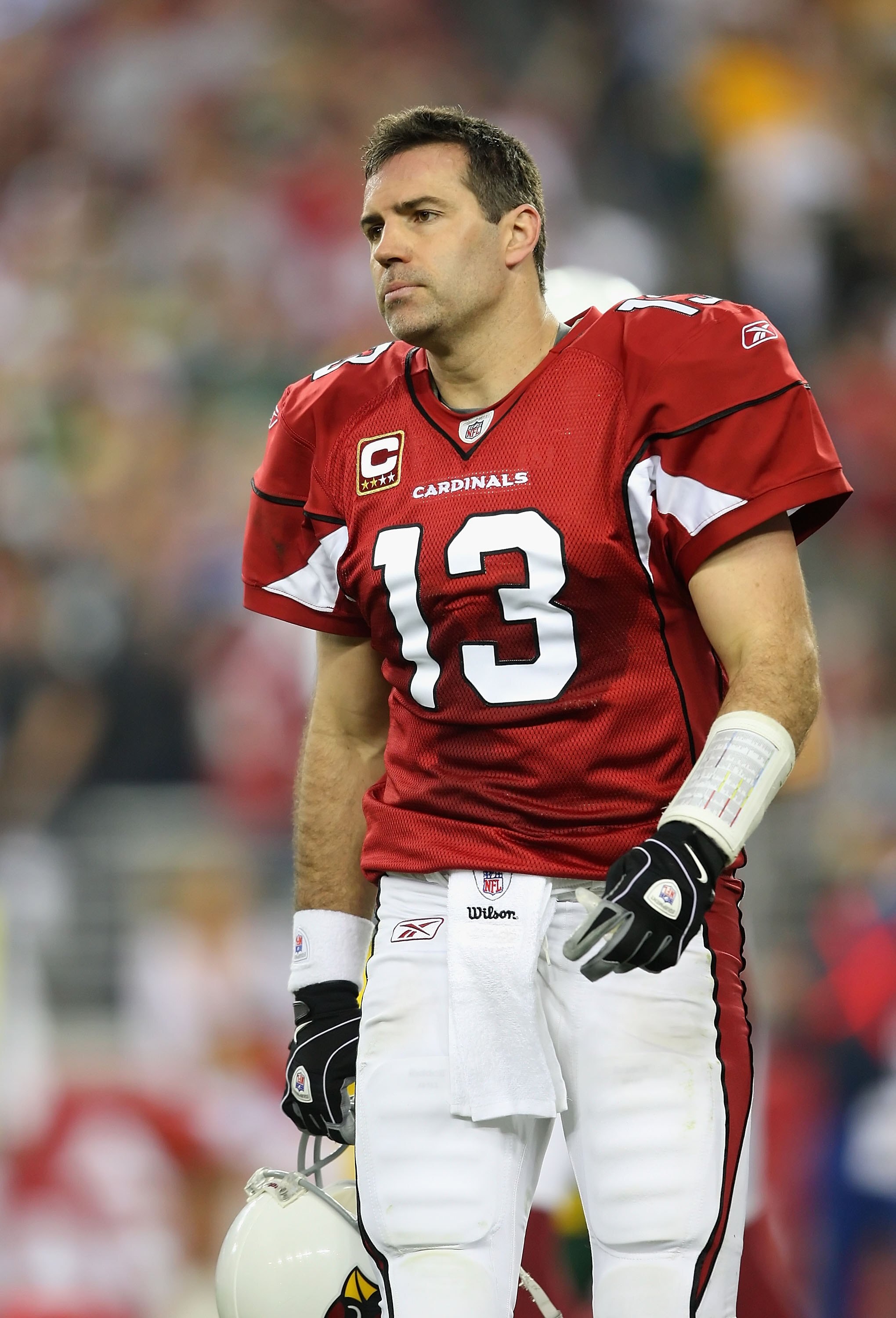 GLENDALE, AZ - JANUARY 10:  Quarterback Kurt Warner #13 of the Arizona Cardinals walks off the field during the 2010 NFC wild-card playoff game against  the Green Bay Packers at the Universtity of Phoenix Stadium on January 10, 2010 in Glendale, Arizona. 