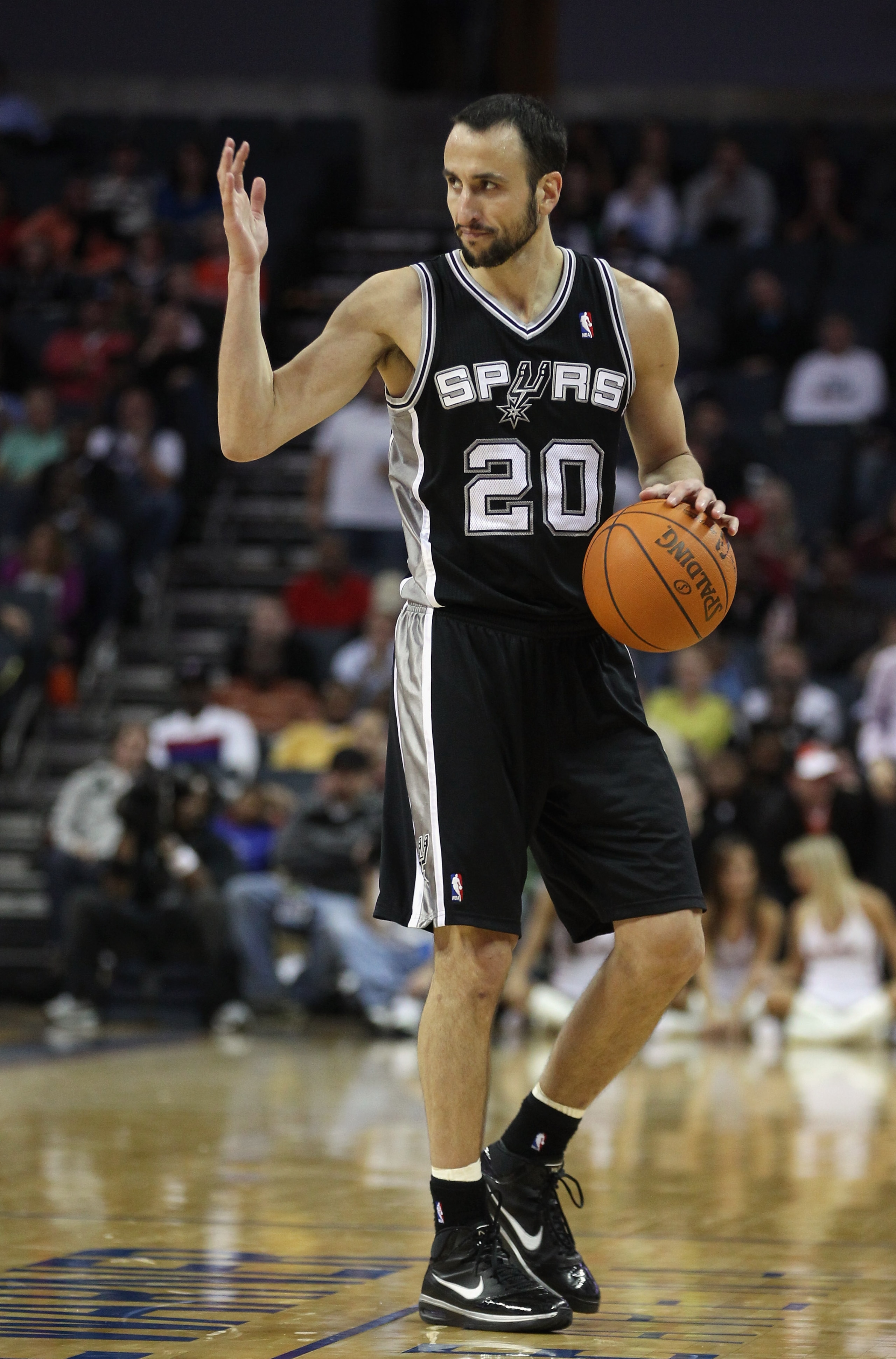 CHARLOTTE, NC - NOVEMBER 08: Manu Ginobili #20 of the San Antonio Spurs against the Charlotte Bobcats during their game at Time Warner Cable Arena on November 8, 2010 in Charlotte, North Carolina. NOTE TO USER: User expressly acknowledges and agrees tha CHARLOTTE, NC - NOVEMBER 08: Manu Ginobili #20 of the San Antonio Spurs against the Charlotte Bobcats during their game at Time Warner Cable Arena on November 8, 2010 in Charlotte, North Carolina. NOTE TO USER: User expressly acknowledges and agrees tha