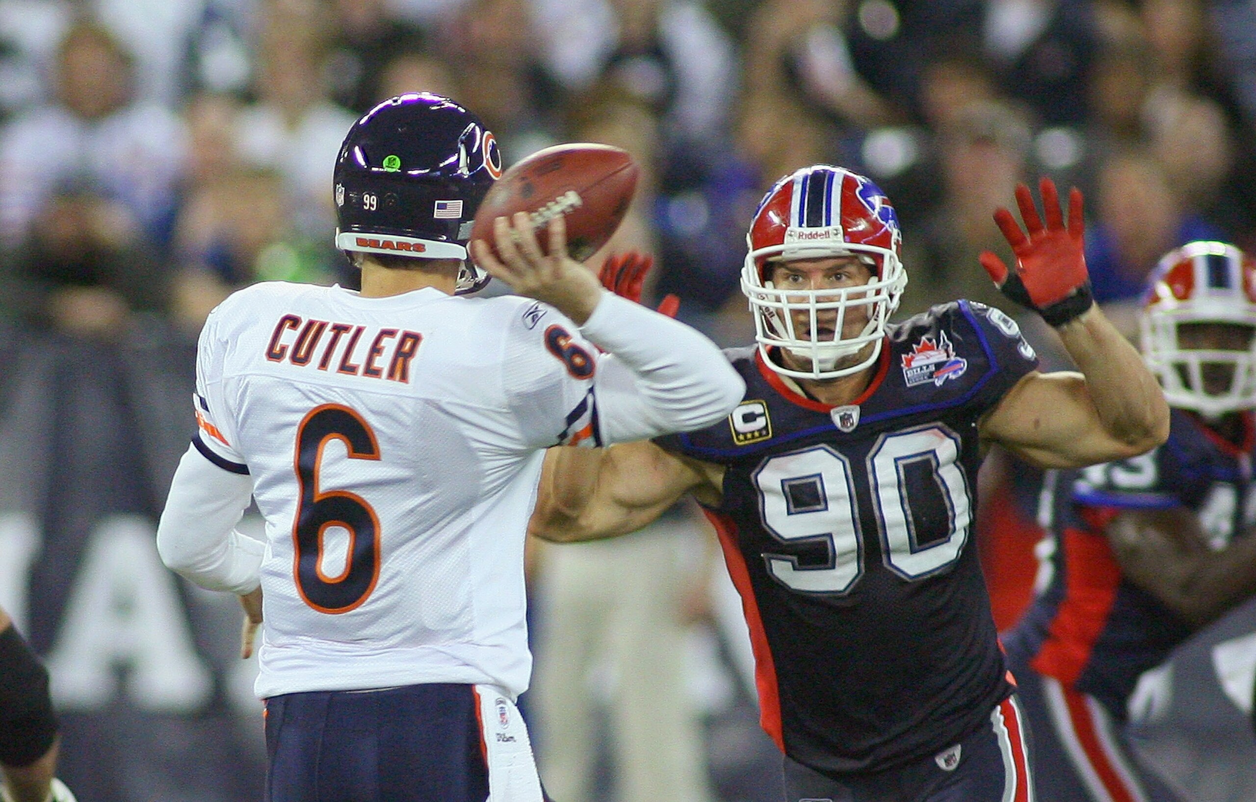 TORONTO, ON - NOVEMBER 07: Chris Kelsay #90 of the Buffalo Bills pressures Jay Cutler #6 of the Chicago Bears at Rogers Centre on November 7, 2010 in Toronto, Canada. Chicago won 22-19. (Photo by Rick Stewart/Getty Images)