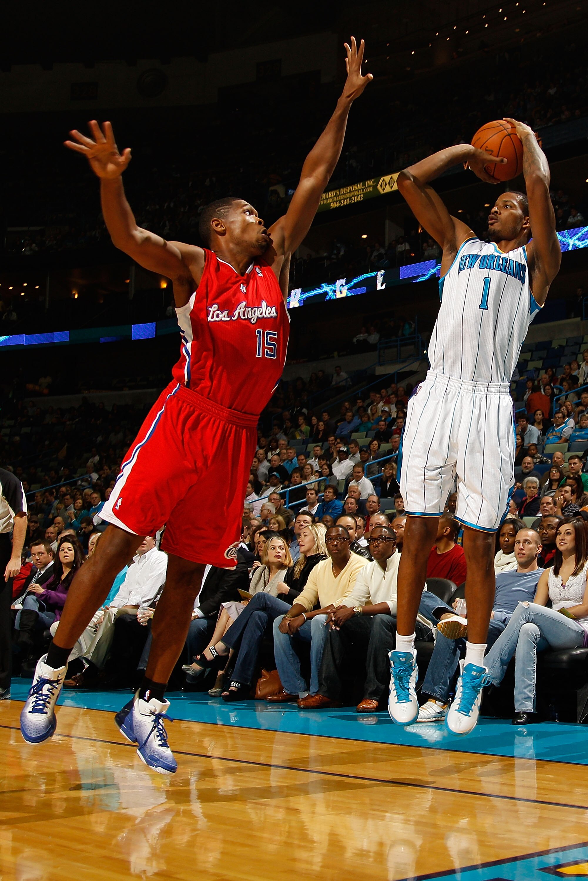NEW ORLEANS - NOVEMBER 09:  Trevor Ariza #1 of the New Orleans Hornets shoots the ball over Ryan Gomes #15 of the Los Angeles Clippers at the New Orleans Arena on November 9, 2010 in New Orleans, Louisiana.  NOTE TO USER: User expressly acknowledges and a