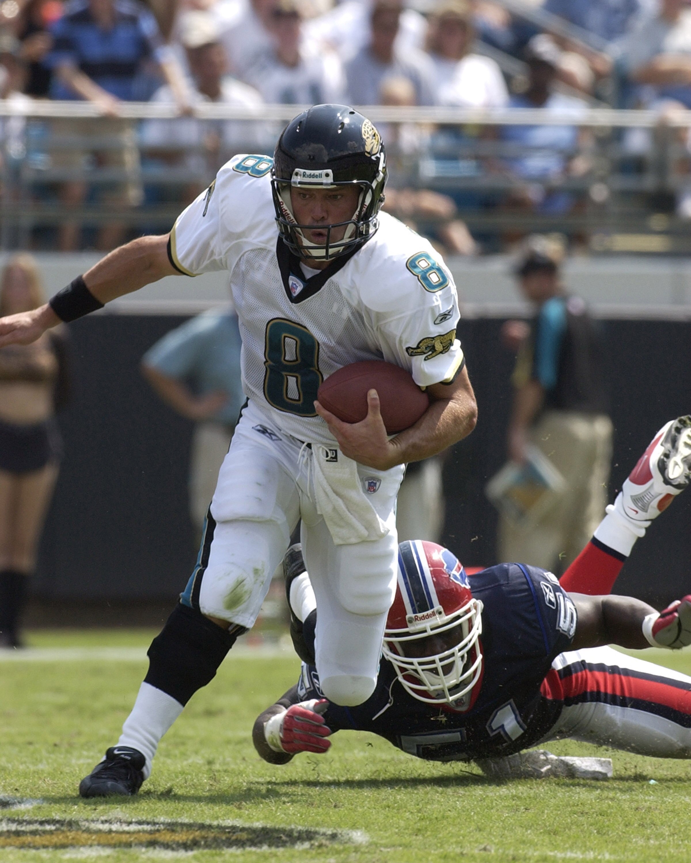 Jacksonville Jaguars quarterback Mark Brunell scrambles against the Buffalo Bills pass rush  Sunday, September 14, 2003 at Alltel Stadium, Jacksonville.  The Bills defeated the Jaguars 38 - 17.  (Photo by Al Messerschmidt/Getty Images)