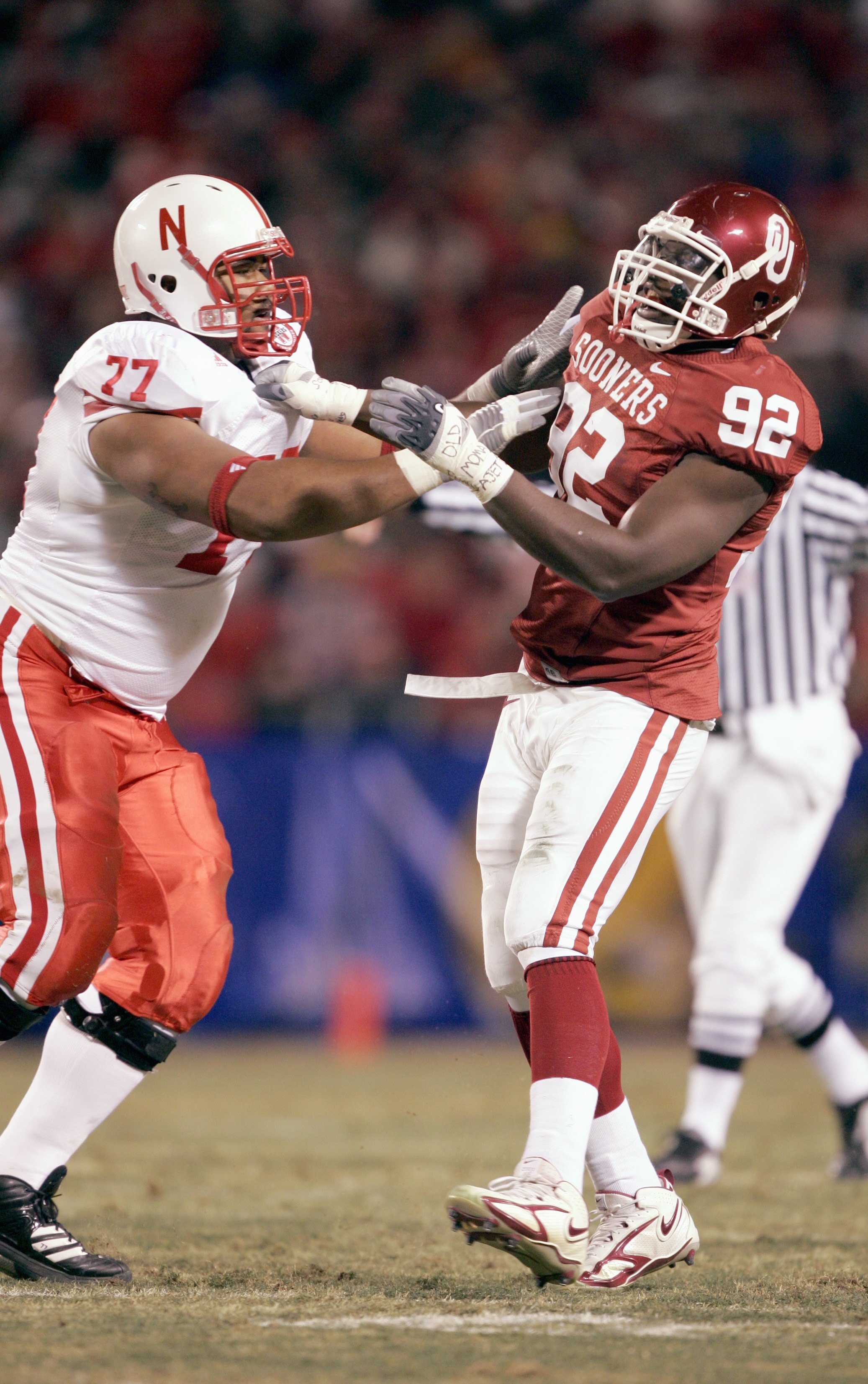 KANSAS CITY, MO - DECEMBER 2: Larry Birdine #92 of the Oklahoma Sooners is blocked by Carl Nicks #77 of the Nebraska Cornhuskers during the 2006 Dr. Pepper Big 12 Championship on December 2, 2006 at Arrowhead Stadium in Kansas City, Missouri. The Sooners
