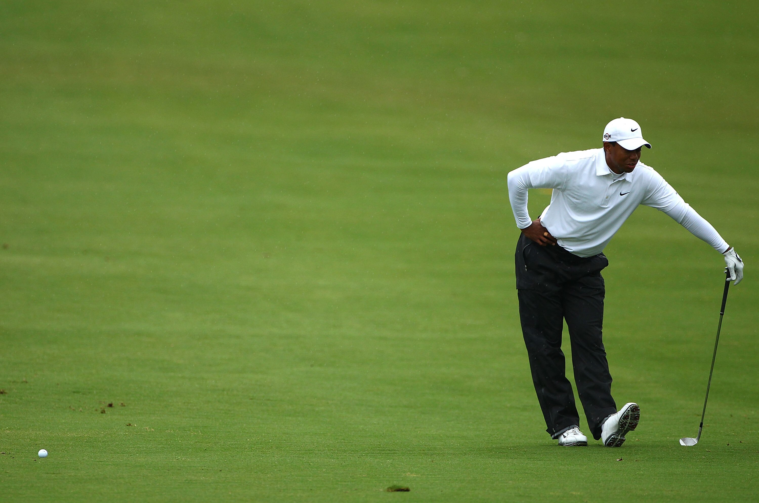MELBOURNE, AUSTRALIA - NOVEMBER 13:  Tiger Woods of Australia stretches on the fairway during round three of the Australian Masters at The Victoria Golf Club on November 13, 2010 in Melbourne, Australia.  (Photo by Robert Cianflone/Getty Images)