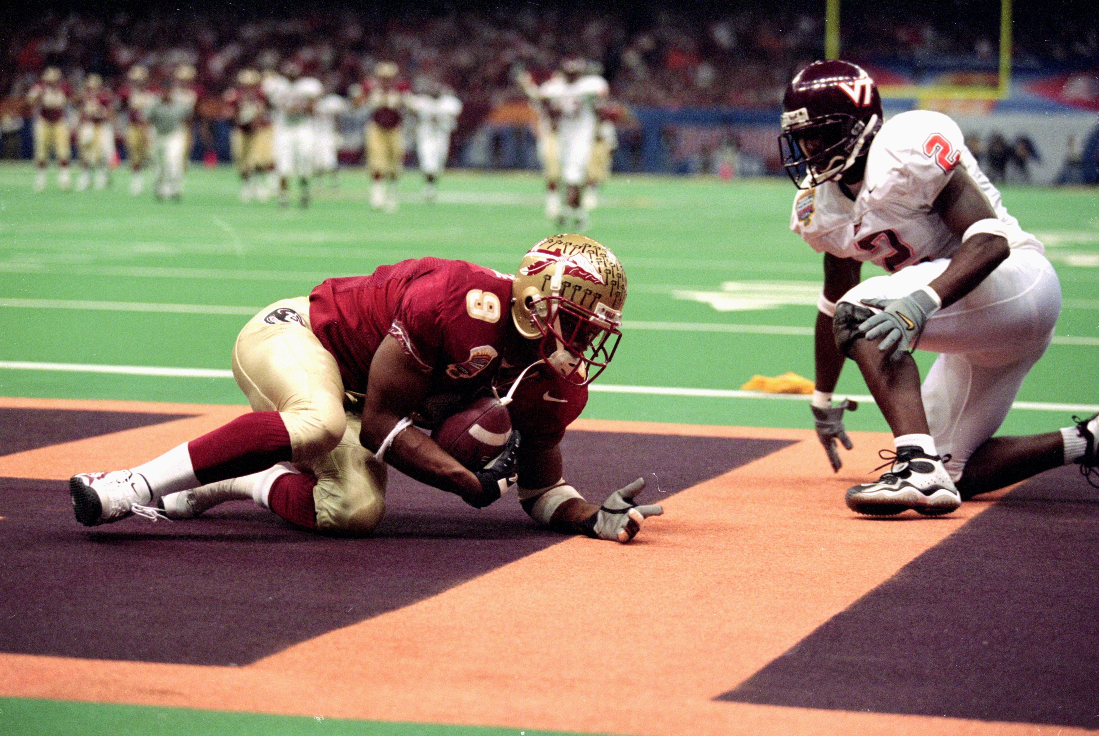 5 Jan 2000:  Peter Warrick #9 of the Florida State Seminoles makes a touchdown during the Nokita Sugar Bowl Game against the Virginia Tech Hokies at the Louisiana Superdome in New Orleans, Louisiana. The Seminoles defeated the Hokies 46-29. Mandatory Cred