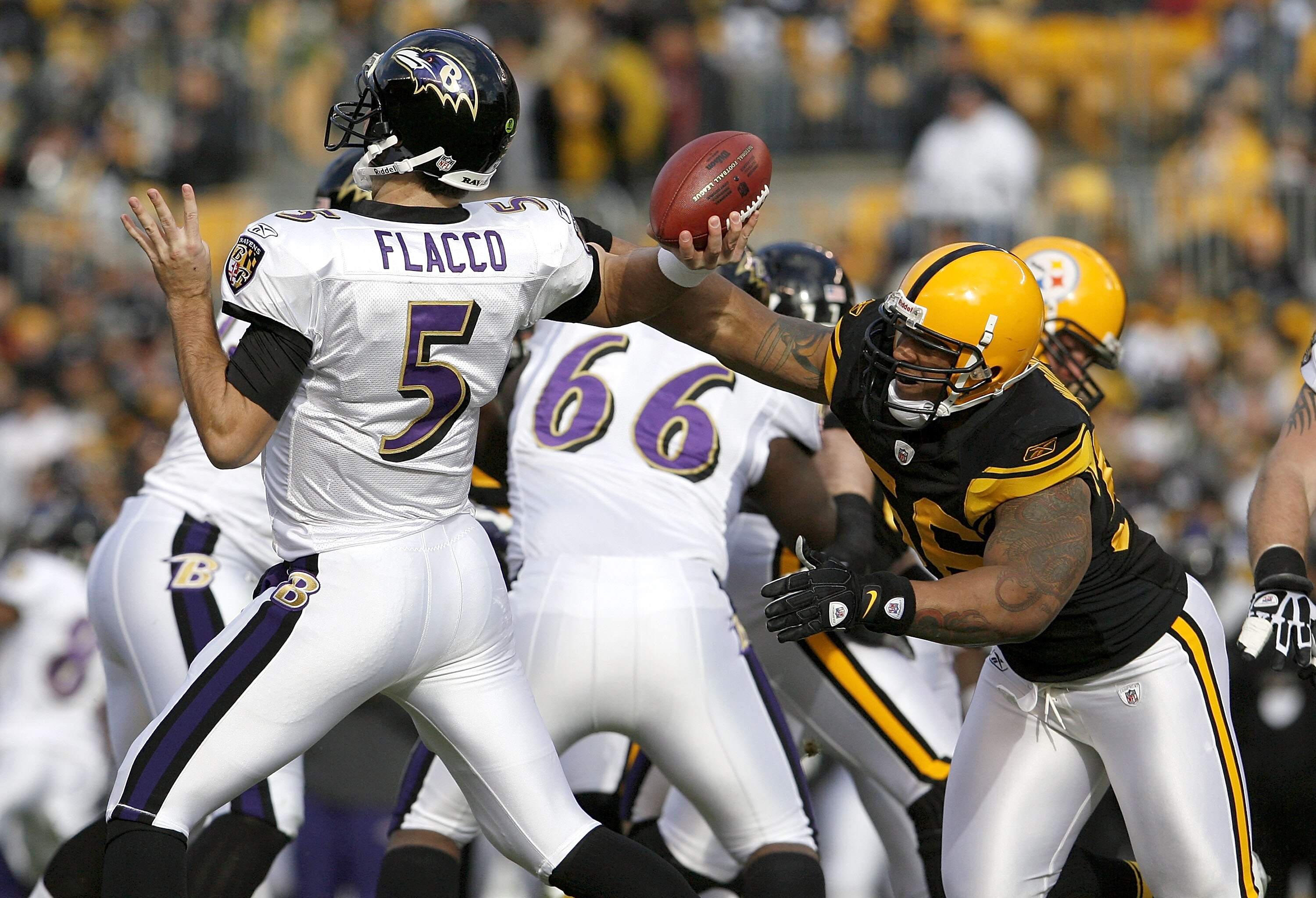 PITTSBURGH - DECEMBER 27: LaMarr Woodley #56 of the Pittsburgh Steelers disrupts the throwing arm of Joe Flacco #5 of the Baltimore Ravens on December 27, 2009 at Heinz Field in Pittsburgh, Pennsylvania. Pittsburgh won the game 23-20. (Photo by Gregory Sh