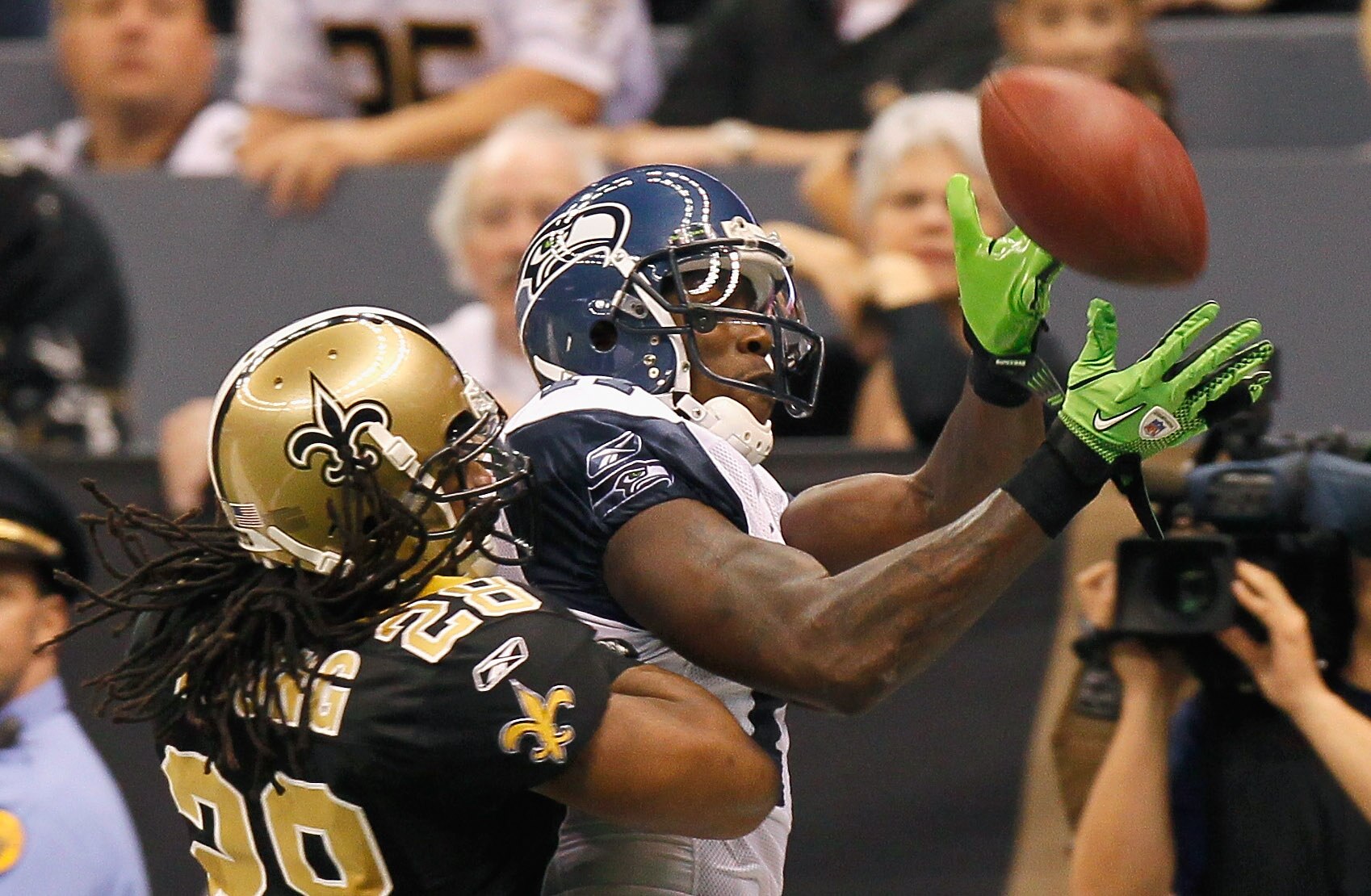 NEW ORLEANS - NOVEMBER 21:  Mike Williams #17 of the Seattle Seahawks fails to pull in this touchdown reception against Usama Young #28 of the New Orleans Saints at Louisiana Superdome on November 21, 2010 in New Orleans, Louisiana.  (Photo by Kevin C. Co
